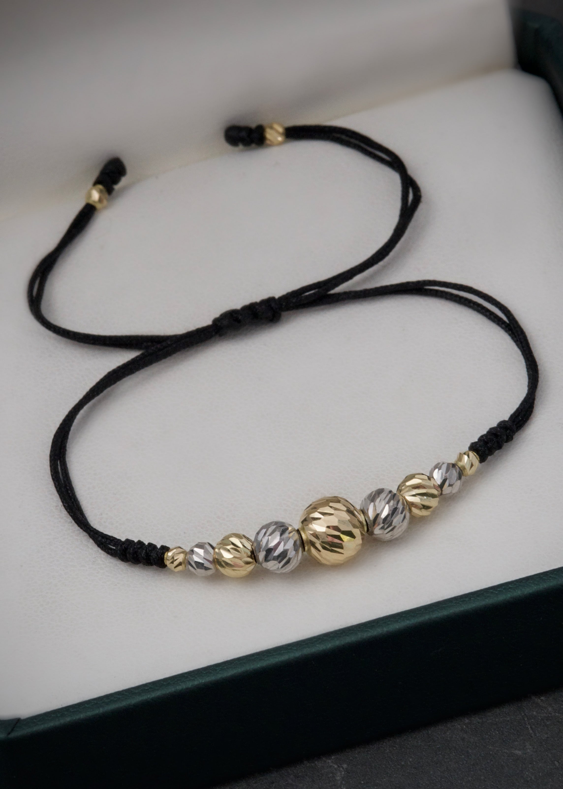 Pulsera en hilo negro con bolas diamantadas 1.5gr / Dos Oros Nac (Joya) M