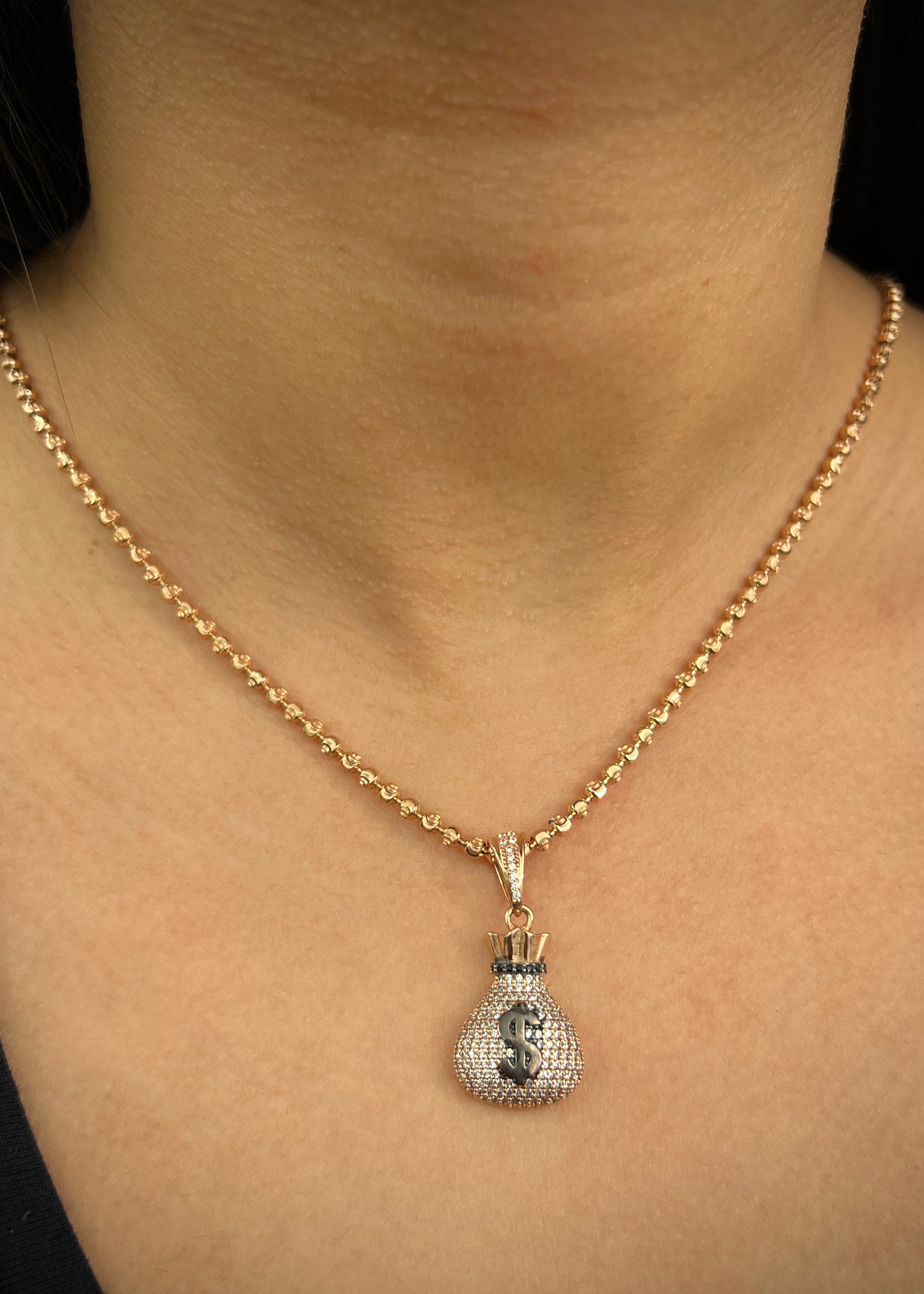 Dije bolsa de dinero con swarovski blanco 6.45gr / Largo 3.5cm / Oro Rosado Nac B