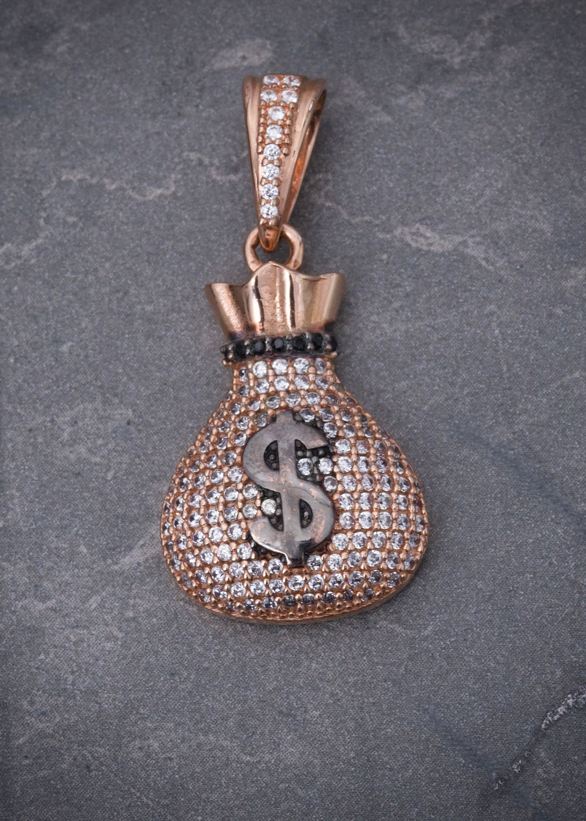 Dije bolsa de dinero con swarovski blanco 6.45gr / Largo 3.5cm / Oro Rosado Nac B