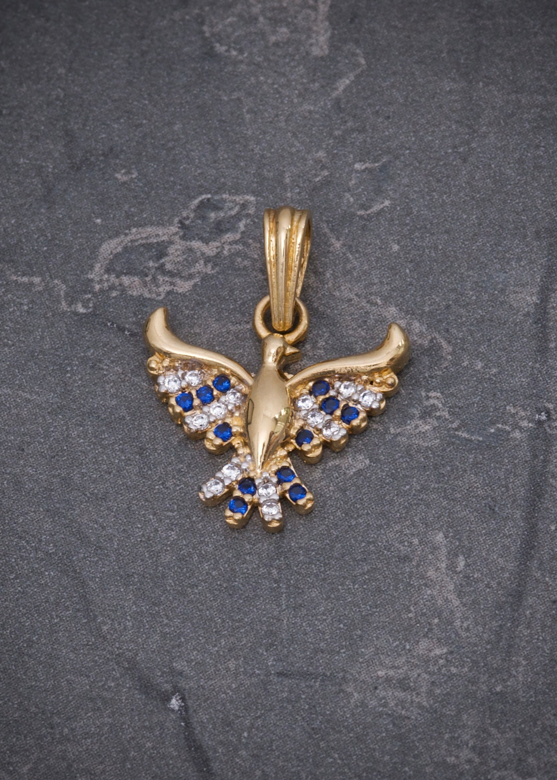 Dije ave fenix con swarovski azul y blanco 1.7gr / Largo 2cm / Oro Amarillo Nac M