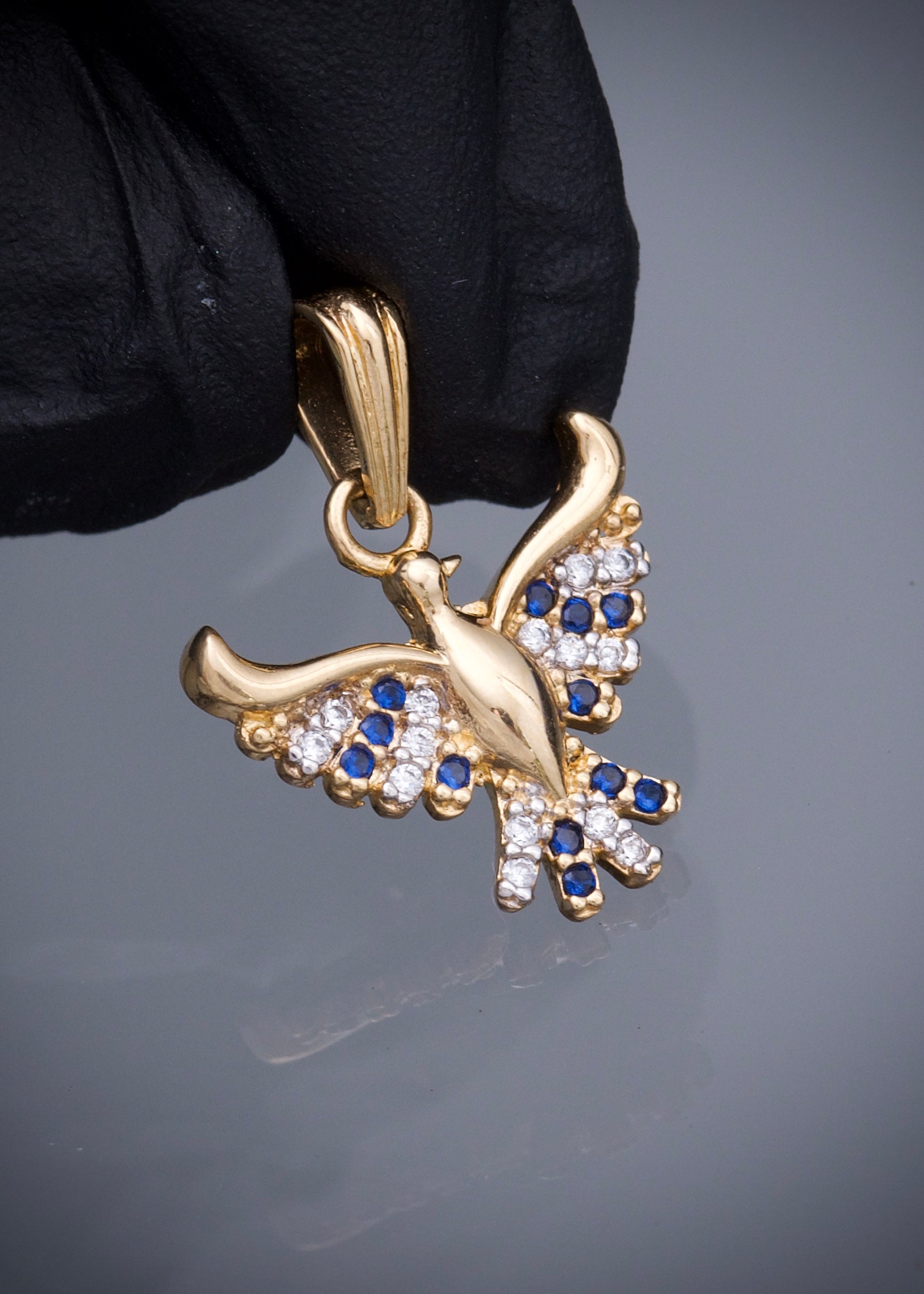 Dije ave fenix con swarovski azul y blanco 1.7gr / Largo 2cm / Oro Amarillo Nac M