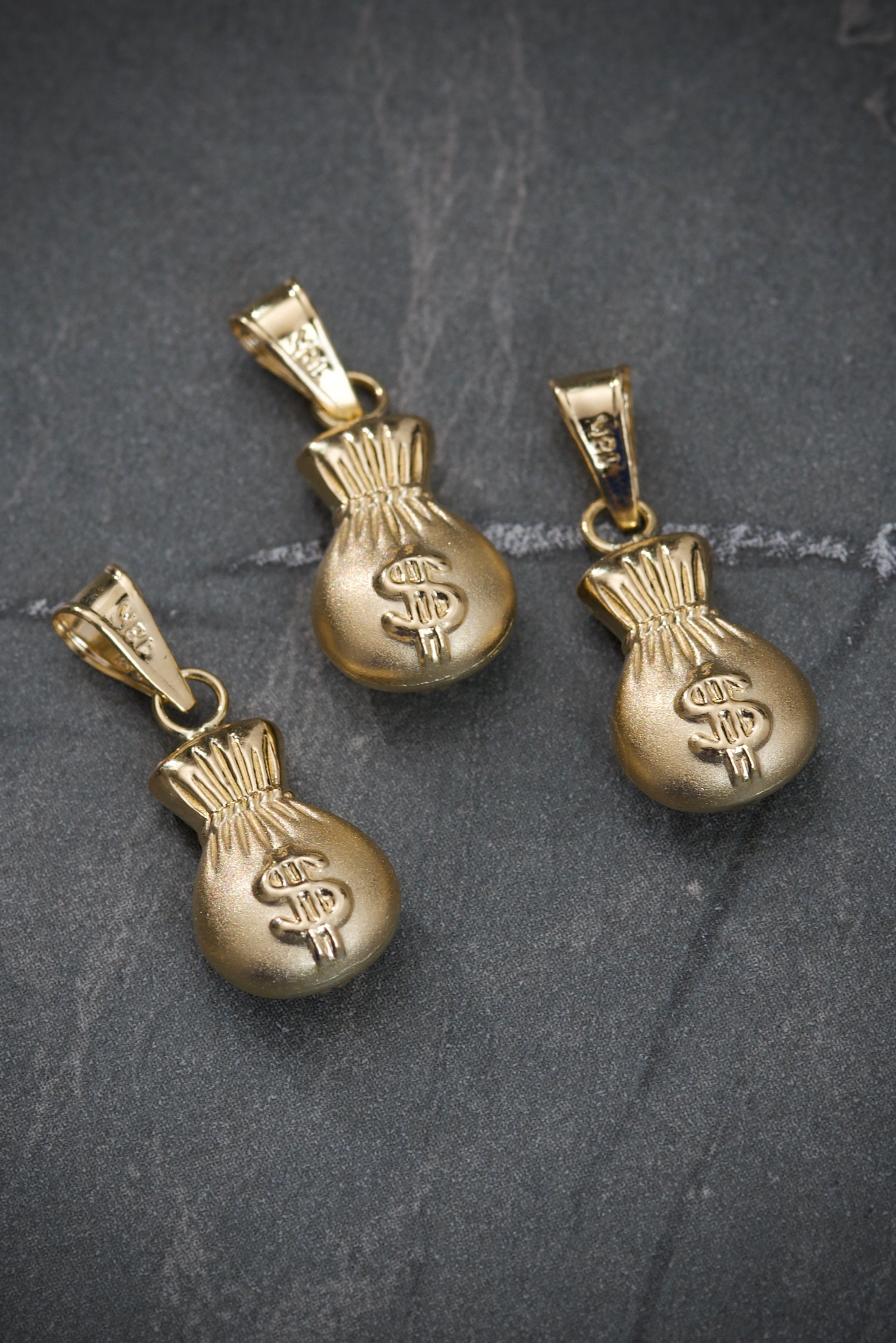 Dije bolsa de dinero 0.75gr / Largo 2.1cm / Oro Amarillo Nac M