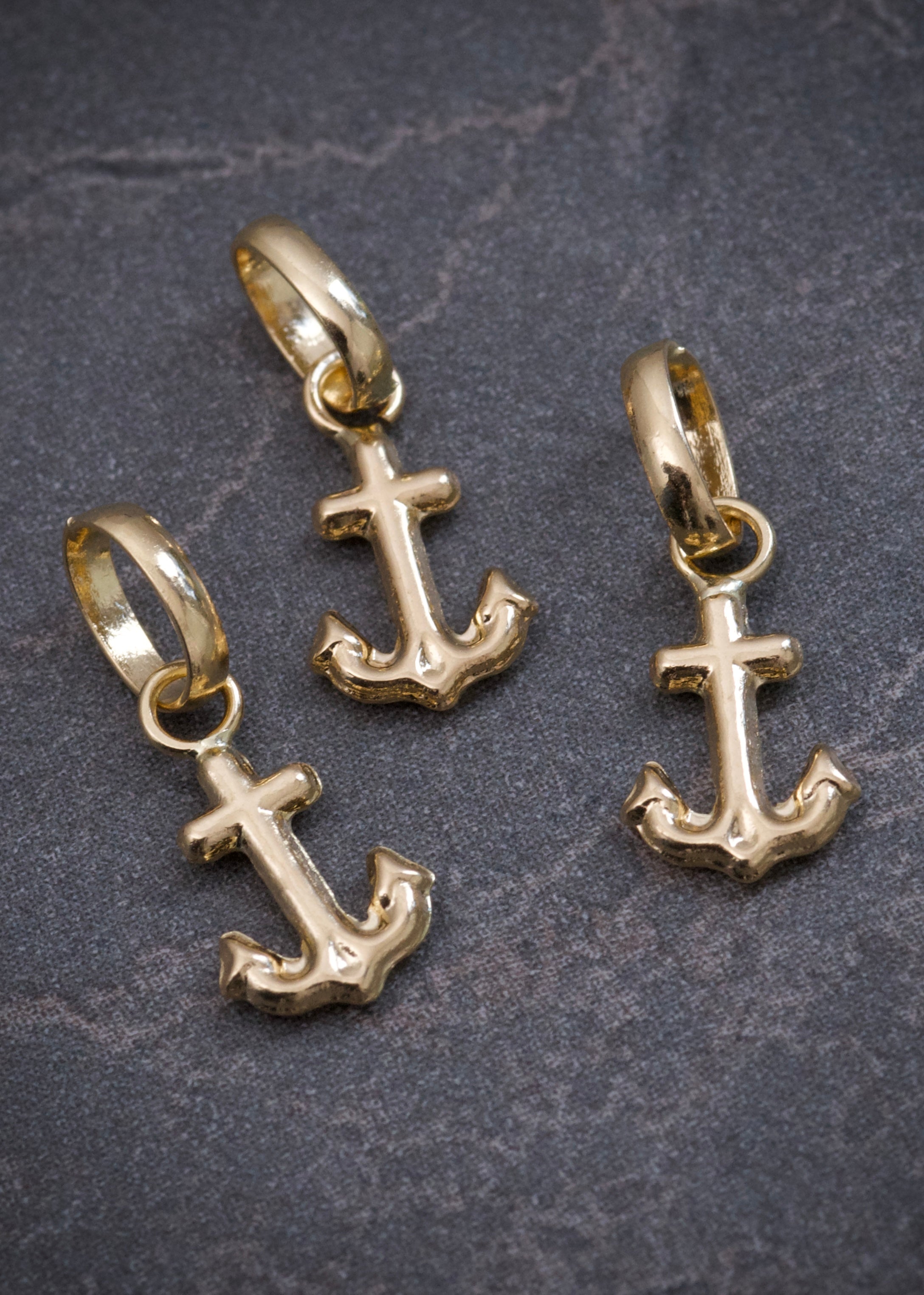 Dije ancla 0.25gr / Largo 1.3cm / Oro Amarillo Nac B