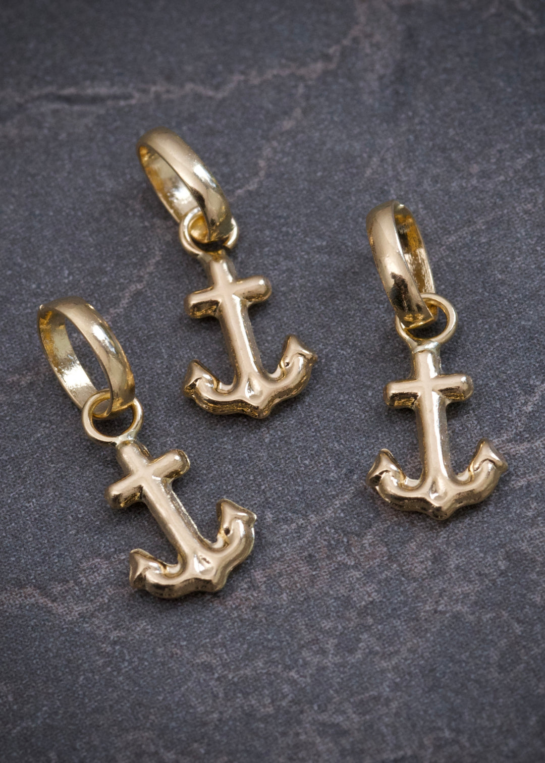 Dije ancla 0.25gr / Largo 1.4cm — Oro Amarillo