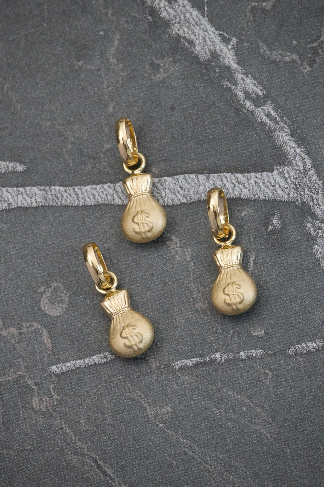 Dije bolsa de dinero 0.3gr / Largo 1.5cm — Oro Amarillo
