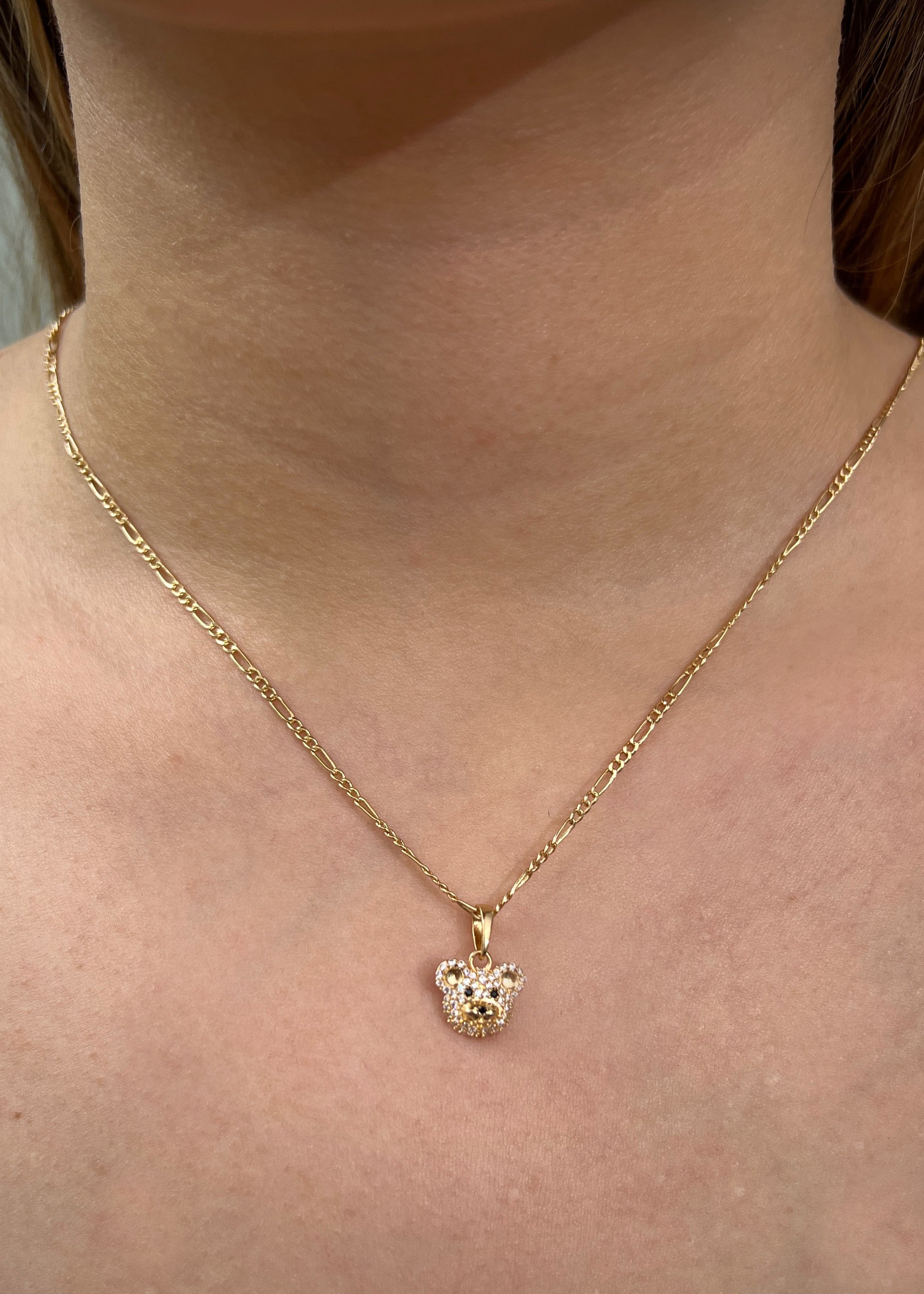 Dije oso con swarovski blanco 1.35gr / Largo 1.6cm / Oro Amarillo Nac*