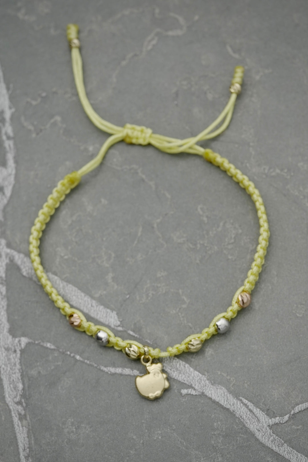 Pulsera en hilo amarillo 1gr — Tres Oros