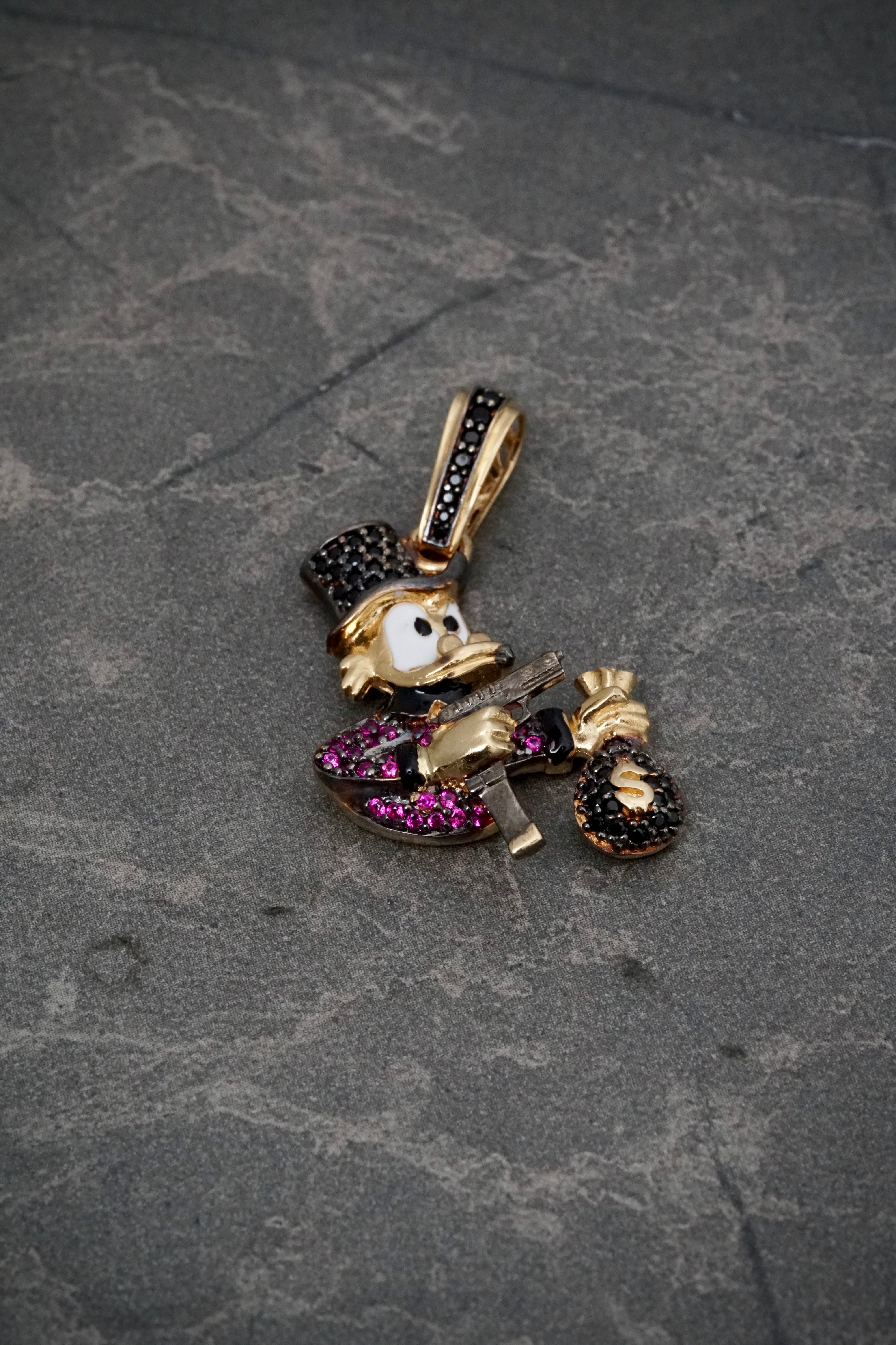 Dije tio rico con swarovski fucsia y negro 6gr / Largo 3.6cm / Oro Amarillo Nac P