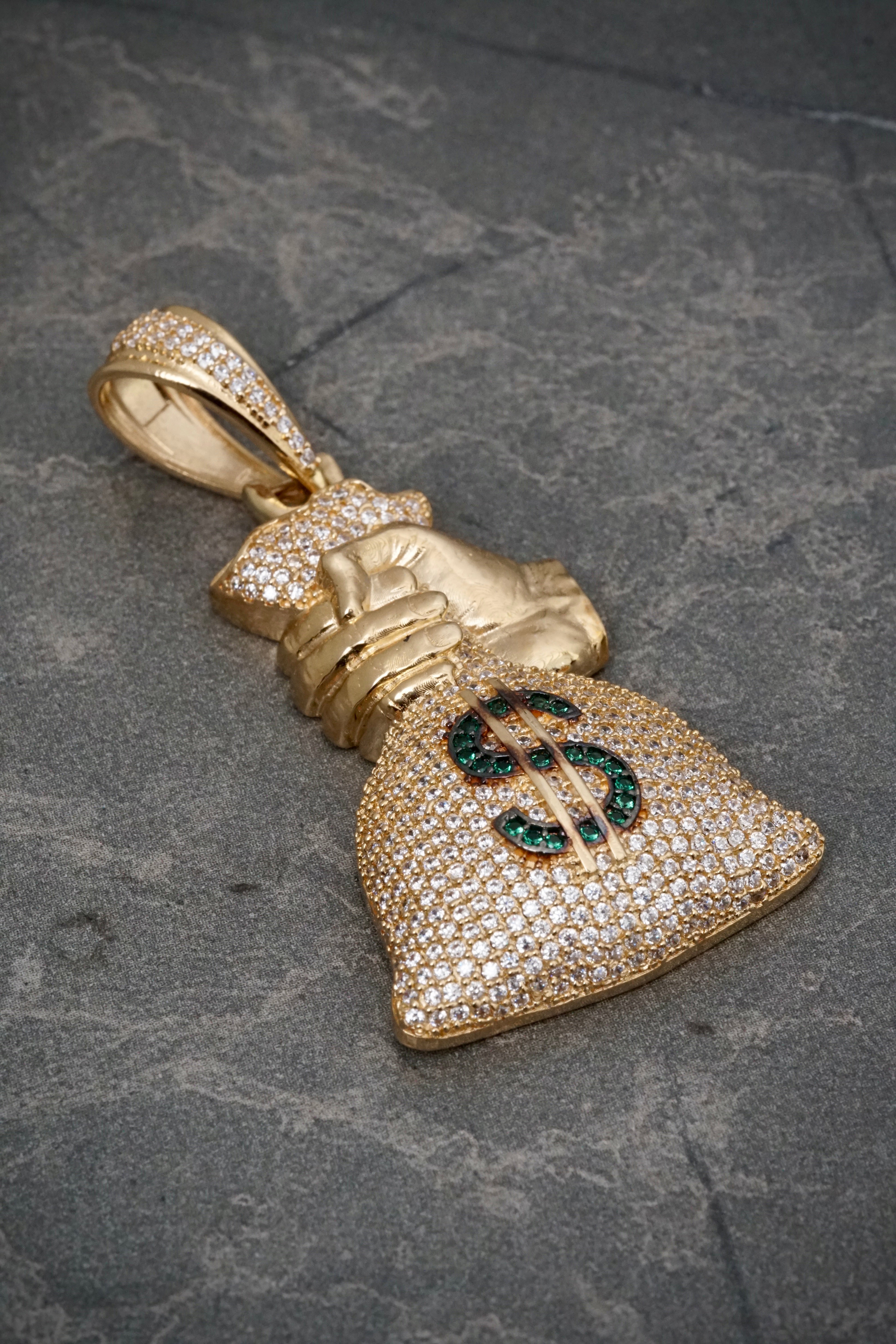 Dije bolsa de dinero con swarovski verde y blanco 11.9gr / Largo 5.3cm / Oro Amarillo Nac B