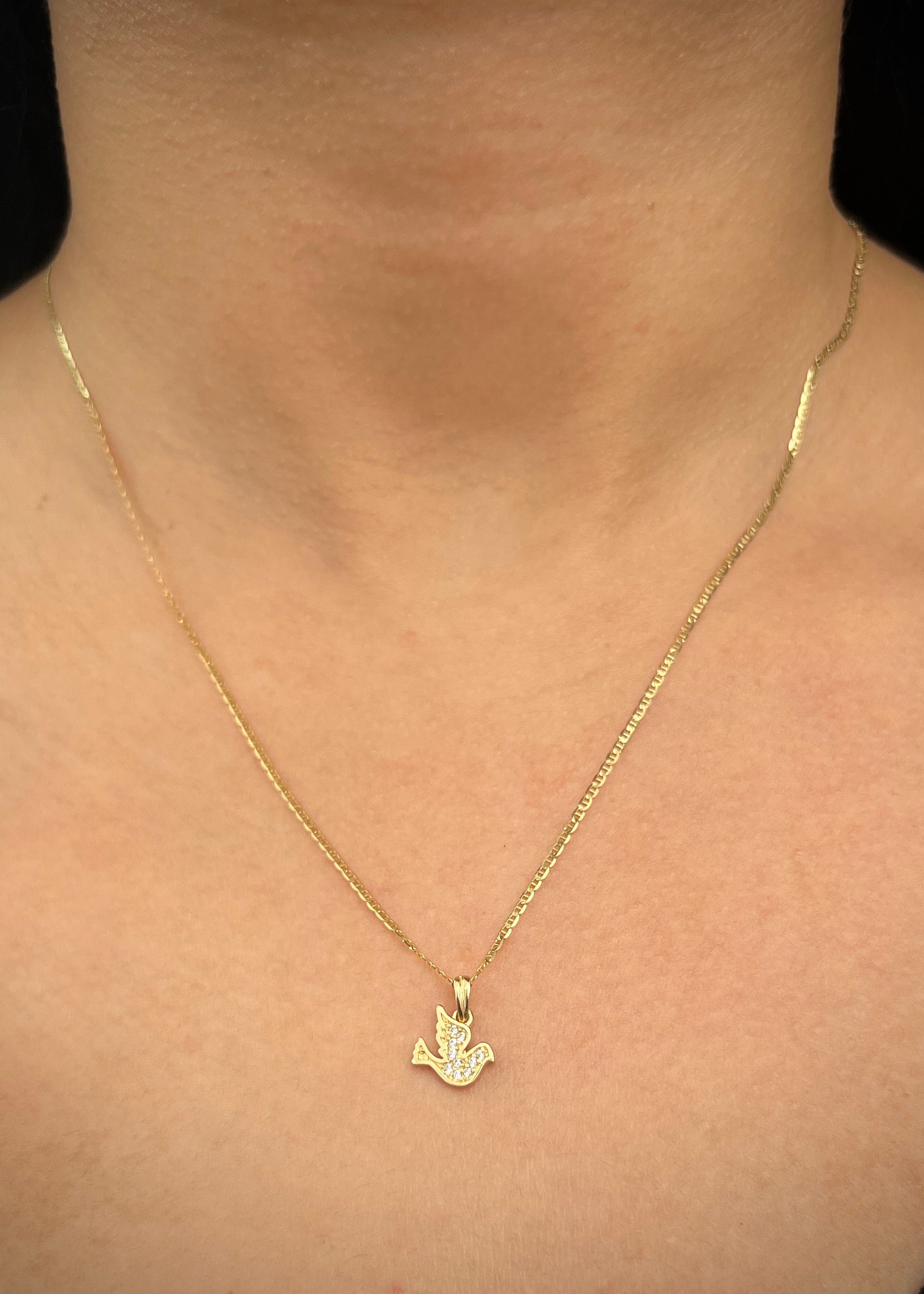 Dije paloma con swarovski blanco 0.8gr / Largo 1.3cm / Oro Amarillo Nac B