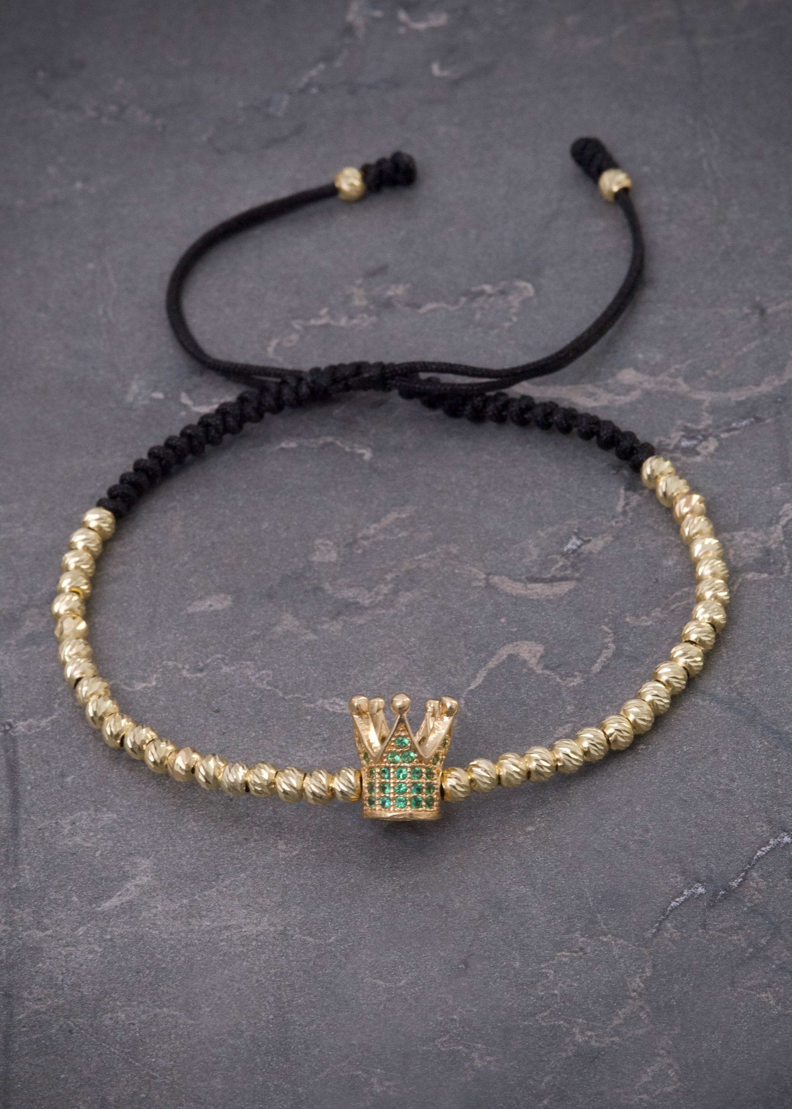 Pulsera en hilo negro con herraje corona y bolas diamantadas 3.8gr / Oro Amarillo (Joya) M