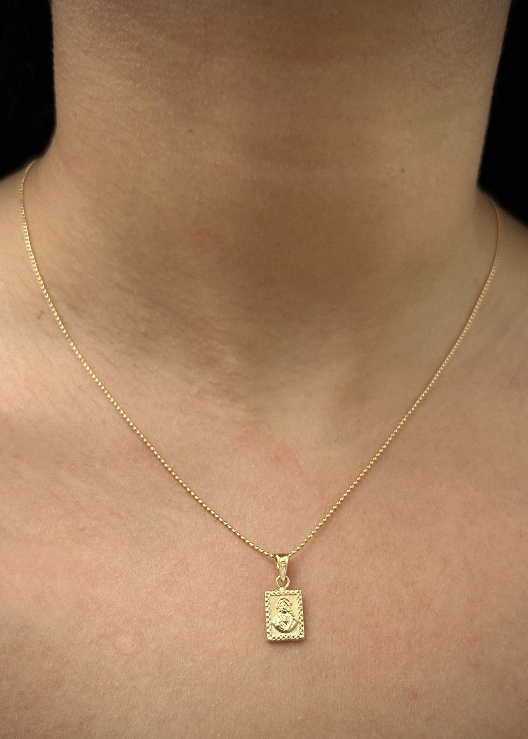 Dije corazon de jesus y virgen del carmen 0.5gr / Largo 1.7cm / Oro Amarillo Nac P