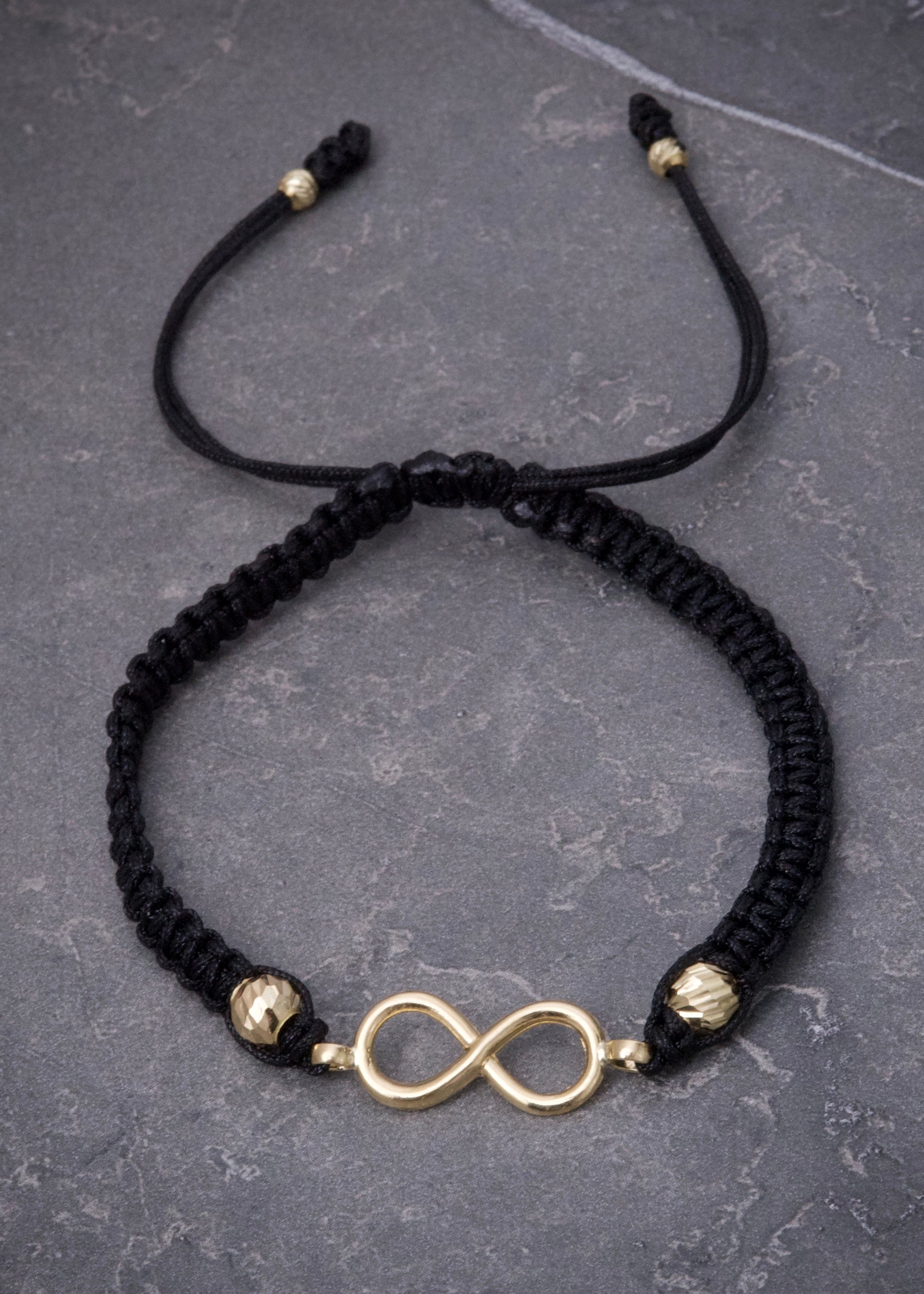 Pulsera en hilo negro con herraje infinito 0.8gr / Oro Amarillo (Joya) M
