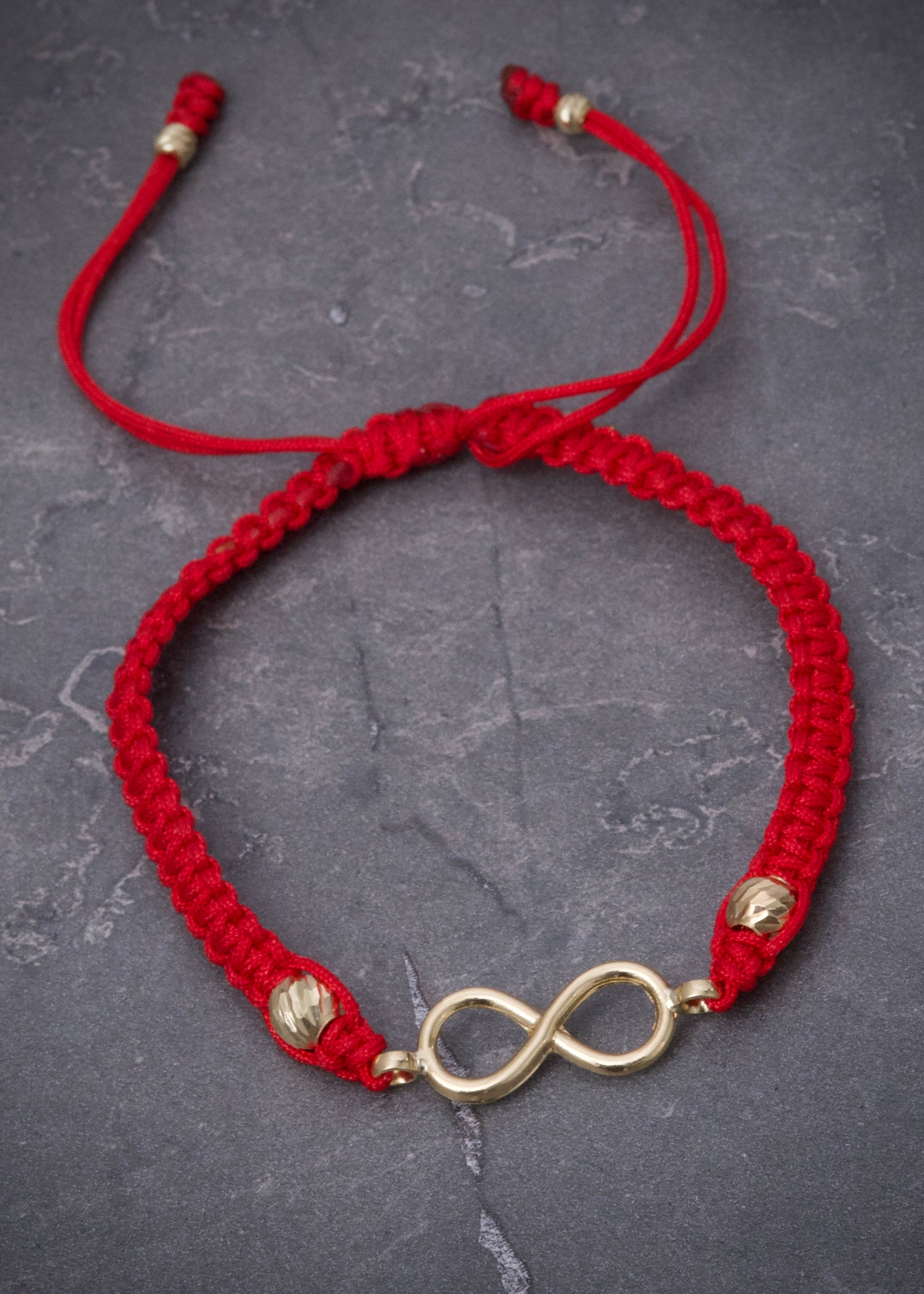 Pulsera en hilo rojo con herraje infinito 0.8gr / Oro Amarillo (Joya) M