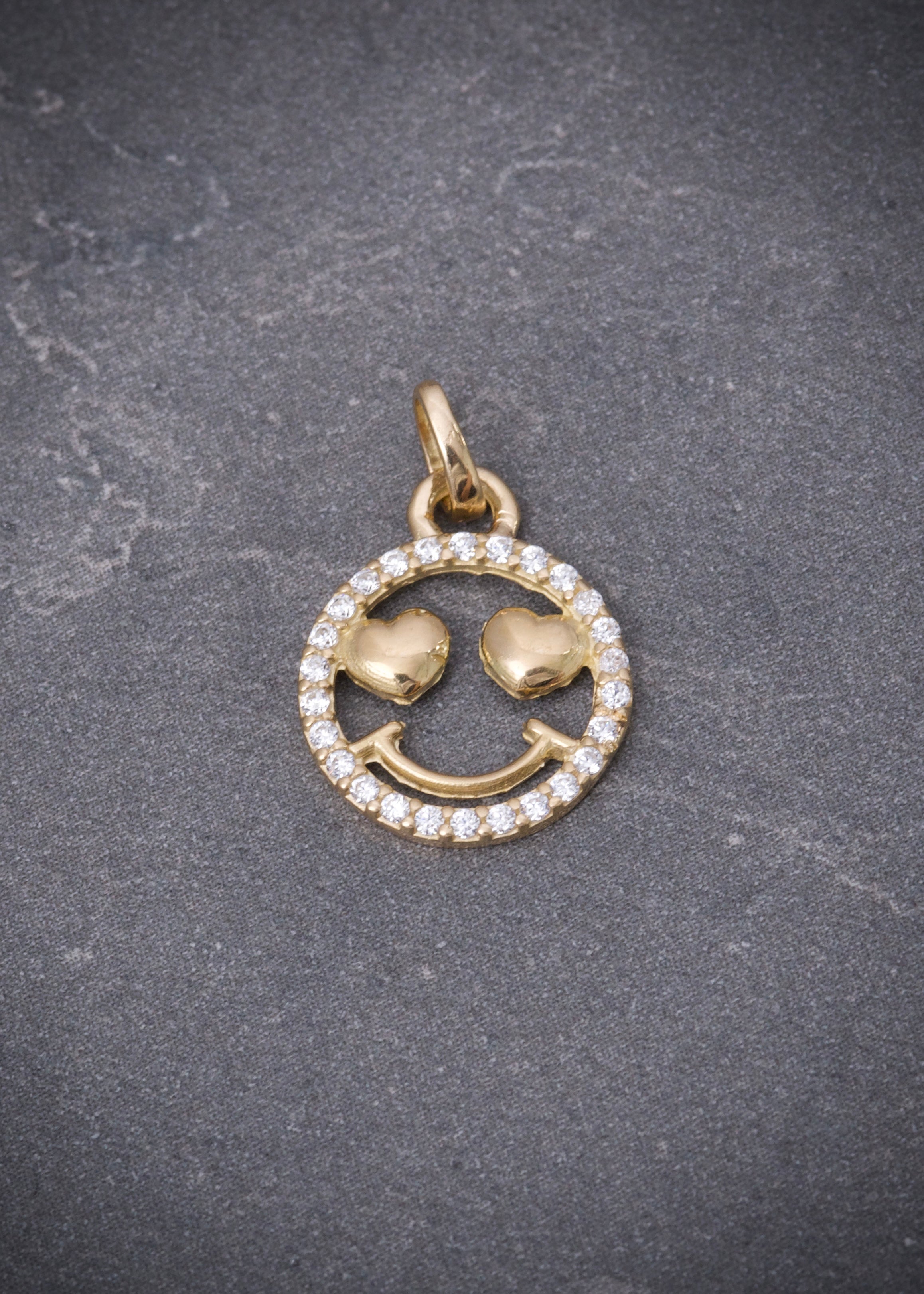 Dije cara feliz con swarovski blanco 0.9gr / Largo 1.8cm / Oro Amarillo Nac*