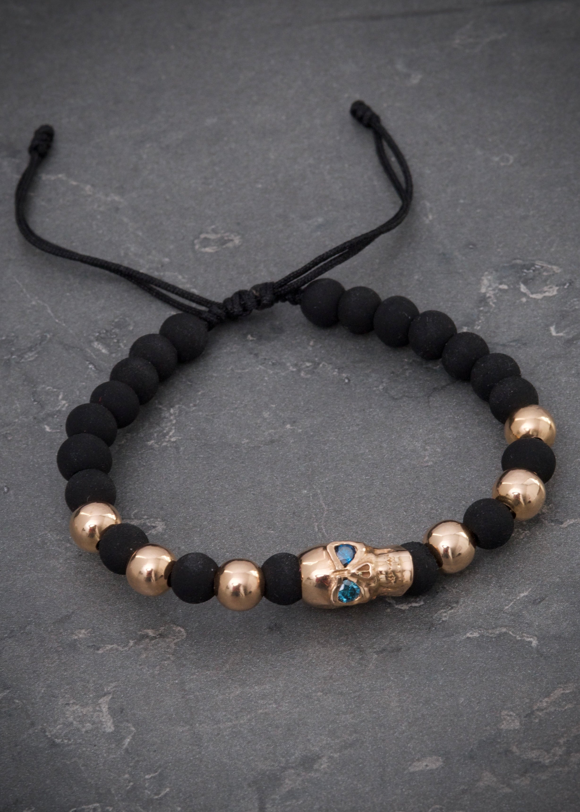 Pulsera en hilo negro con herraje calavera 4.86gr / Oro Rosado (Joya) M