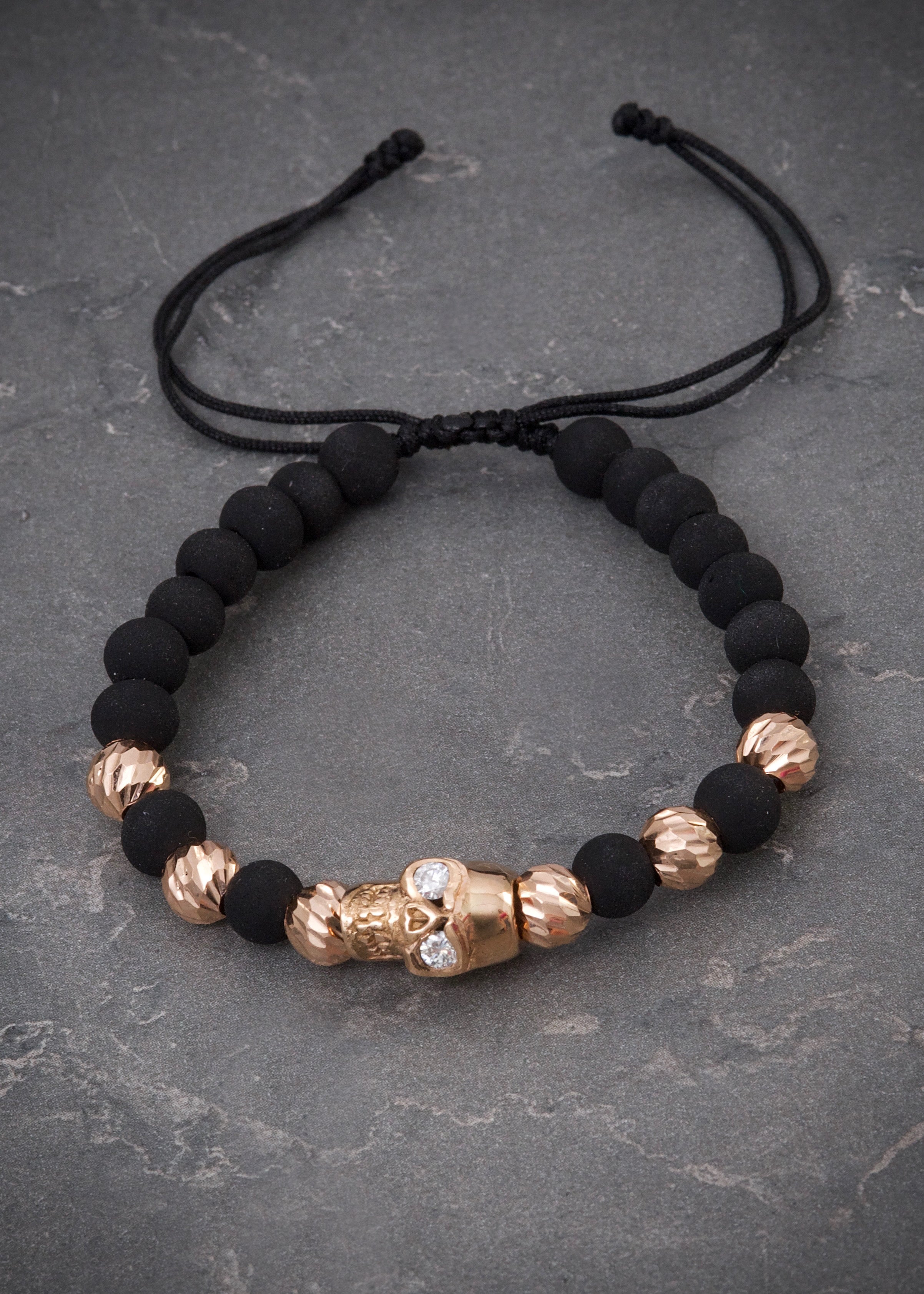 Pulsera en hilo negro con herraje calavera 4.94gr / Oro Rosado (Joya) M