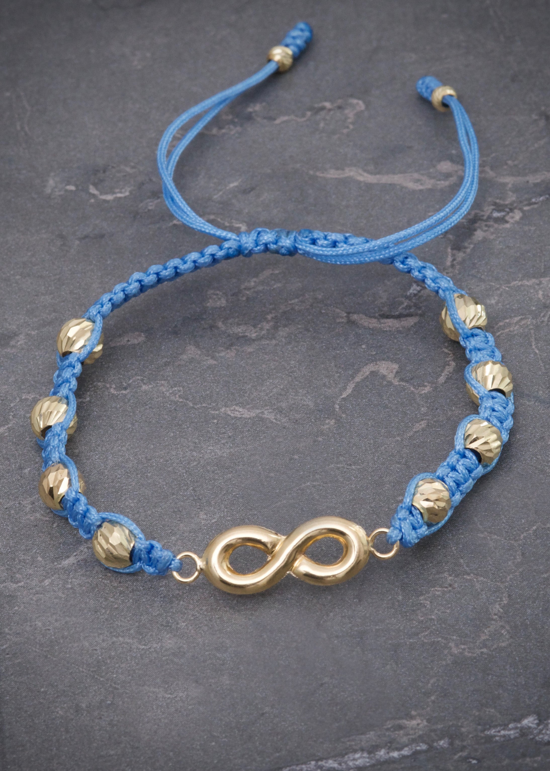 Pulsera en hilo azul con herraje de infinito 1.75gr / Oro Amarillo (Joya) M