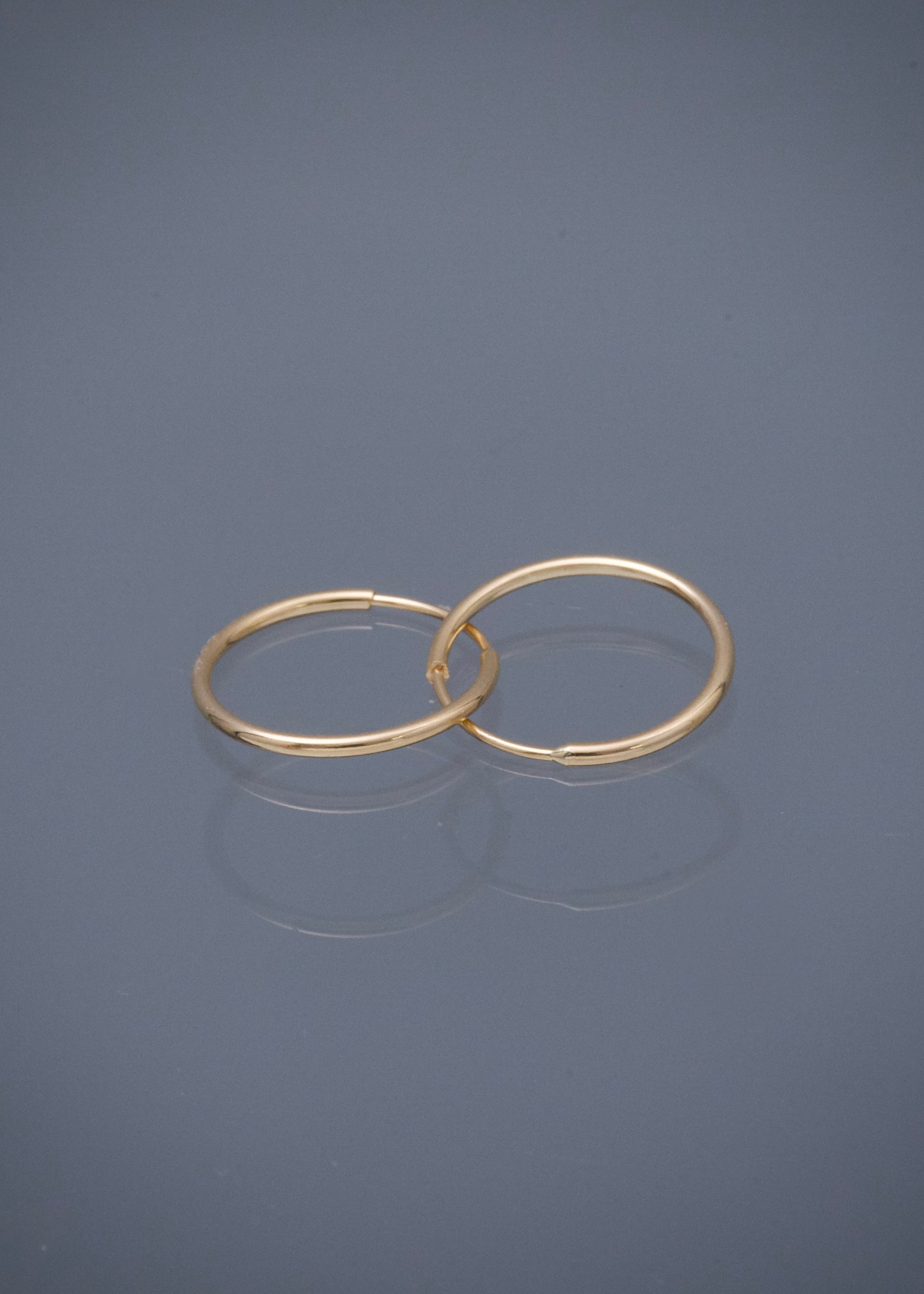 Candongas lisas 0.55gr / Largo 1.2cm — Oro Amarillo