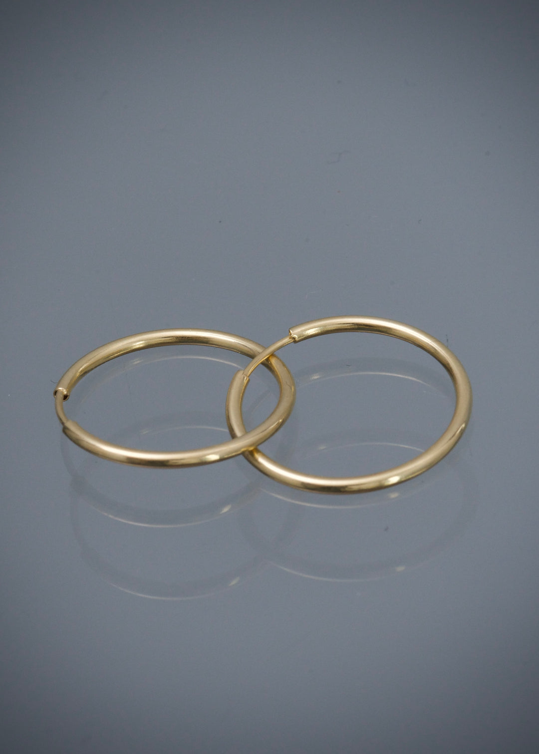 Candongas Lisas 0.7gr / 1.5cm / 1.1mm — Oro Amarillo