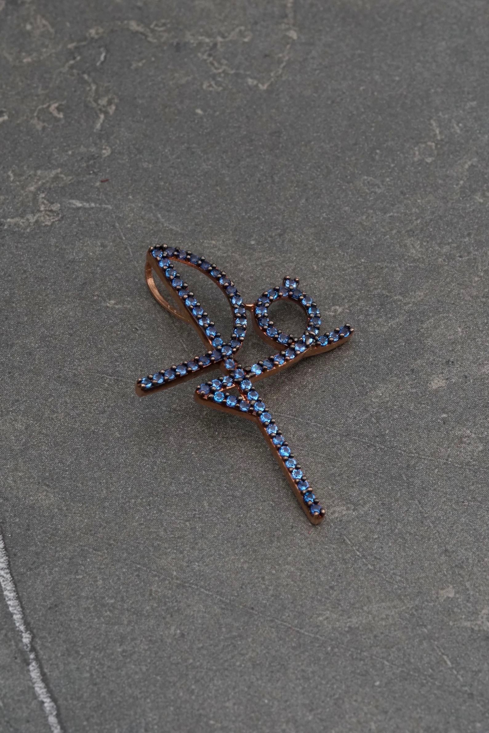 Dije fe con swarovski azul 2.8gr / Largo 3.7cm / Oro Rosado Nac P