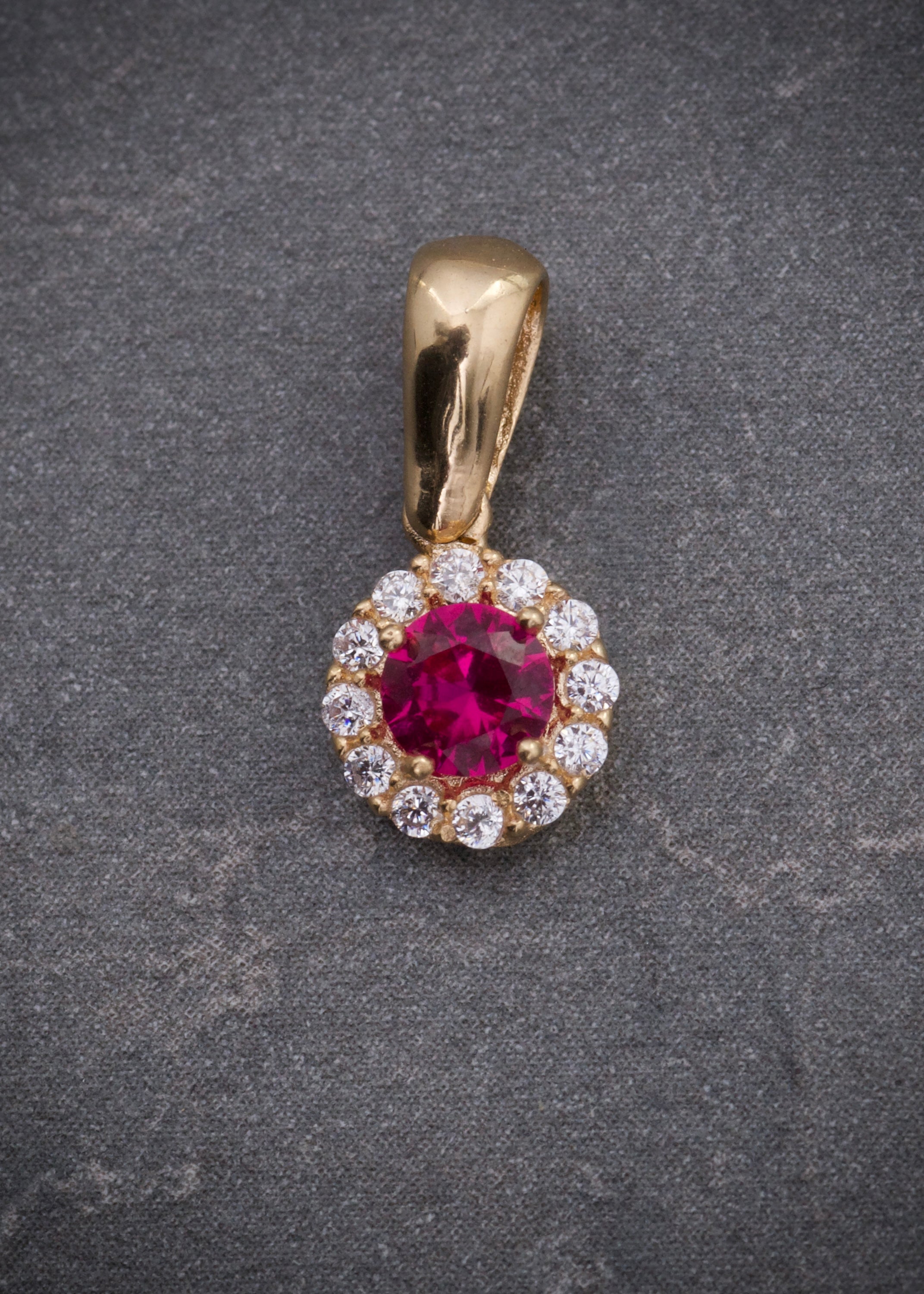 Dije flor con swarovski fucsia y blanco 0.85gr / Largo 1.4cm / Oro Amarillo Nac P