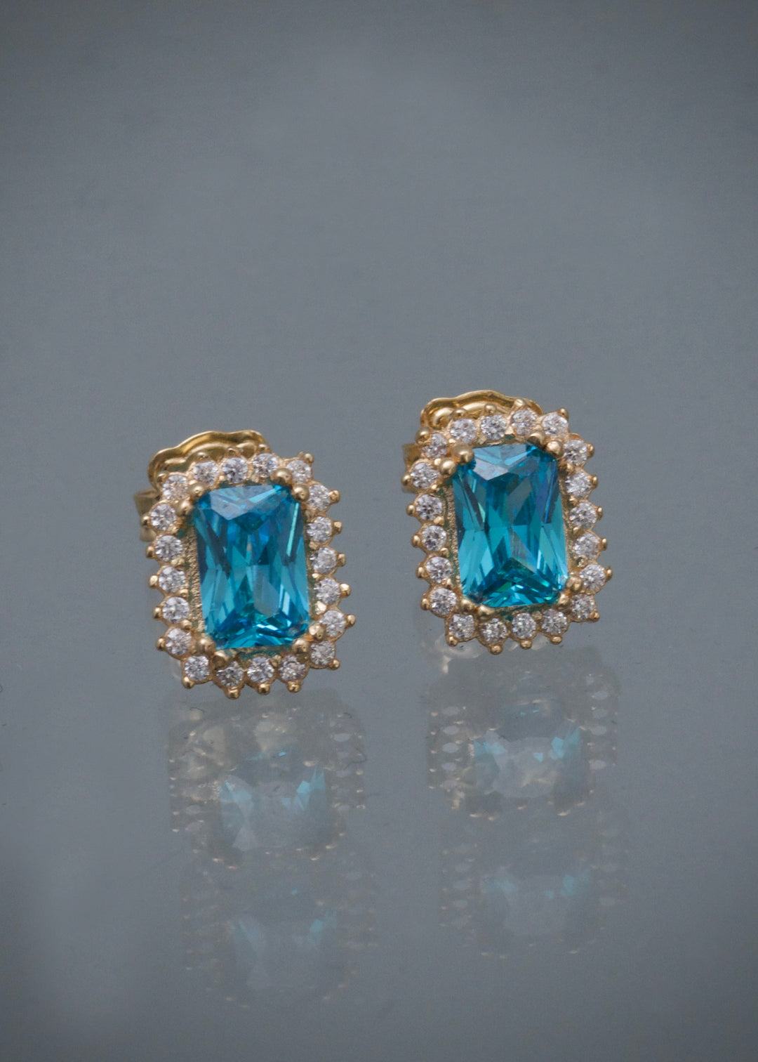 Topos con swarovski azul y blanco 2.25gr / Largo 0.9cm — Oro Amarillo