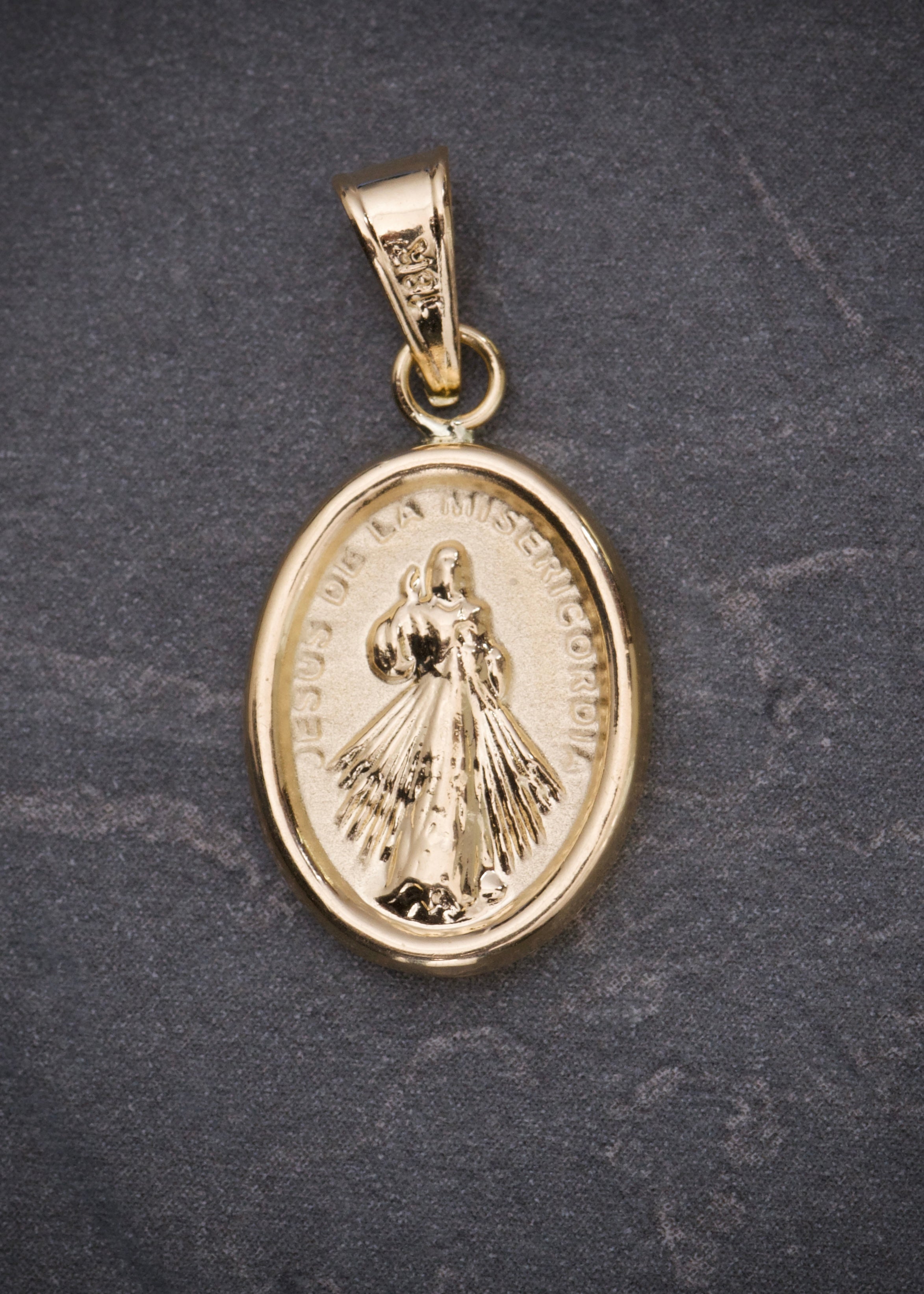 Dije jesus de la misericordia 0.95gr / Largo 2.5cm / Oro Amarillo Nac M