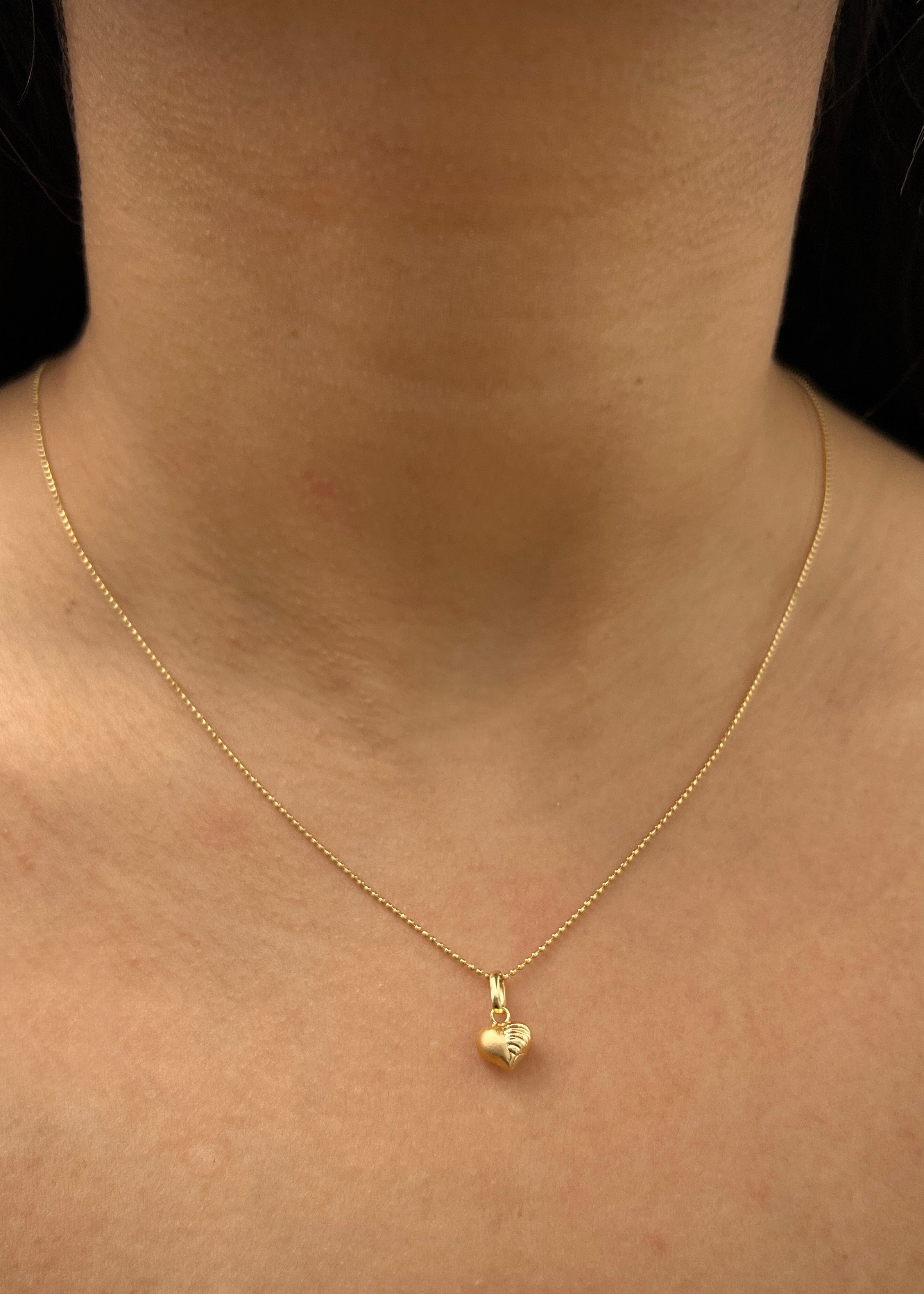 Dije corazon diamantado 0.35gr / Largo 1.3cm / Oro Amarillo Nac M