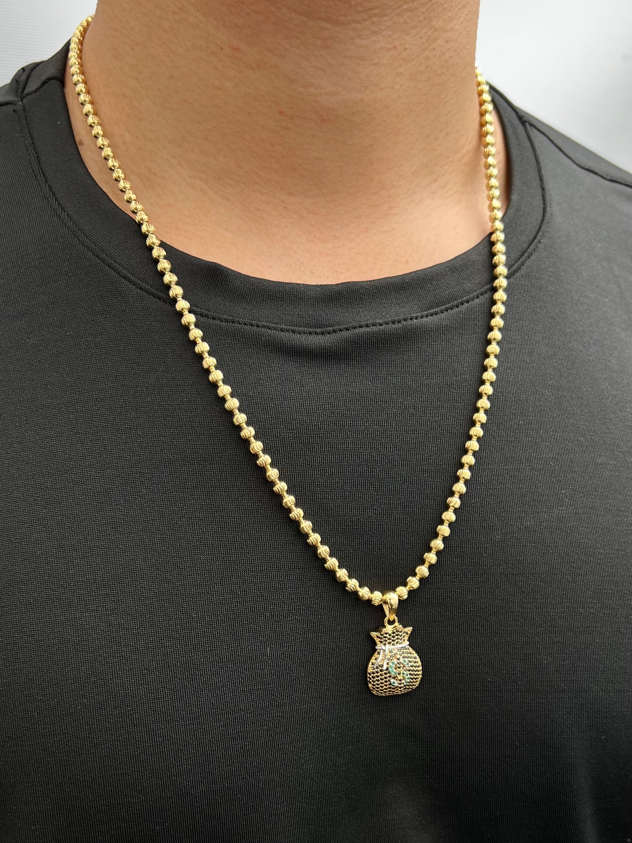 Dije bolsa de dinero con swarovski negro y verde 4.45gr / Largo 3cm / Oro Amarillo Nac P