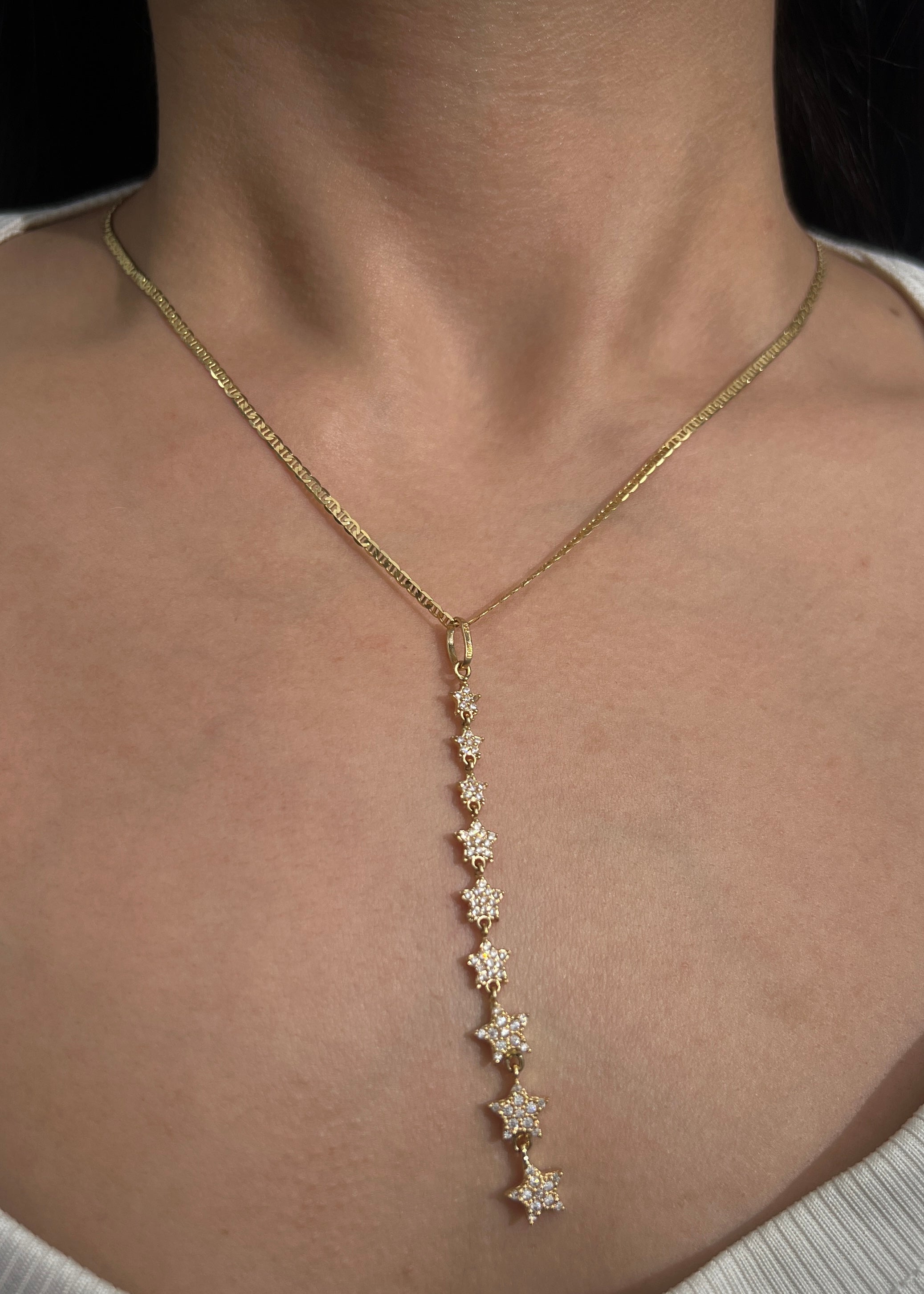 Dije estrellas con swarovski blanco 2.85gr / Largo 7.7cm / Oro Amarillo Nac M