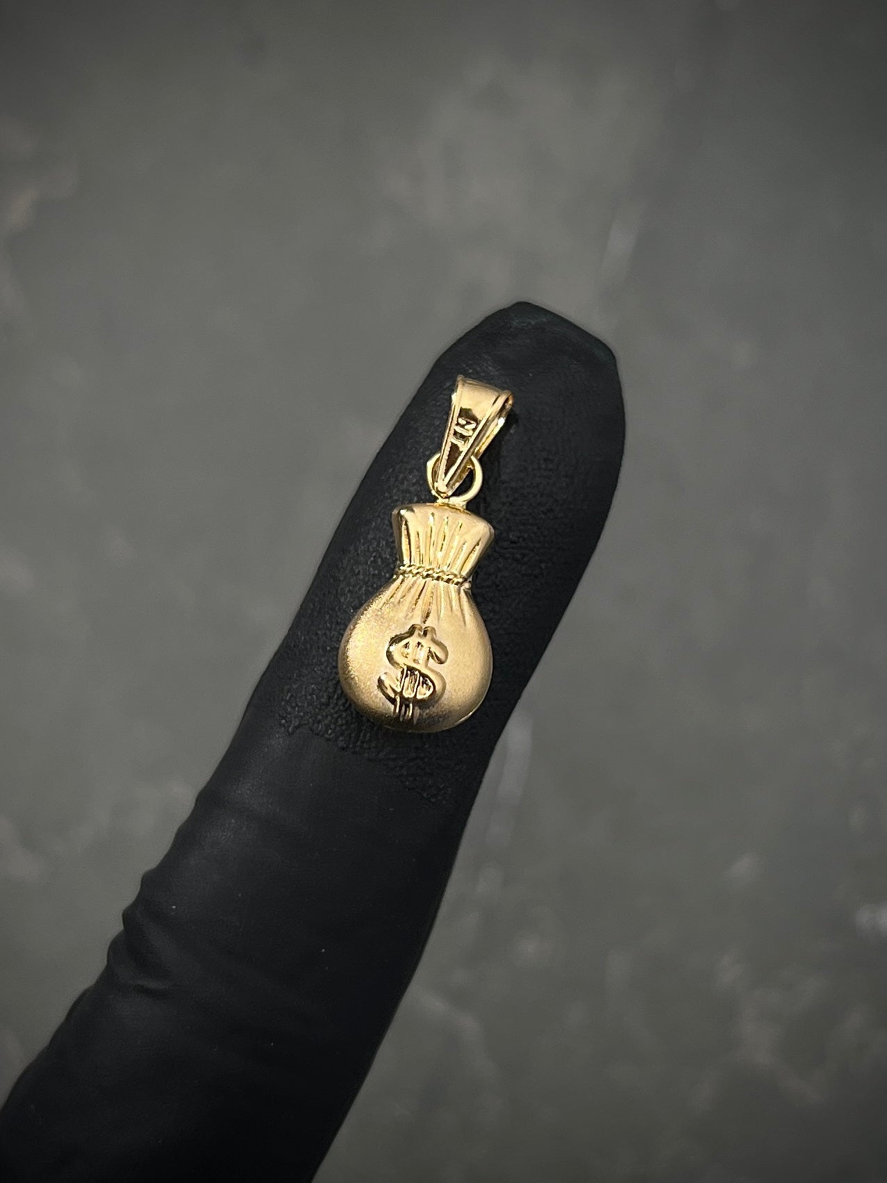 Dije bolsa de dinero 0.75gr / Largo 2.1cm / Oro Amarillo Nac M