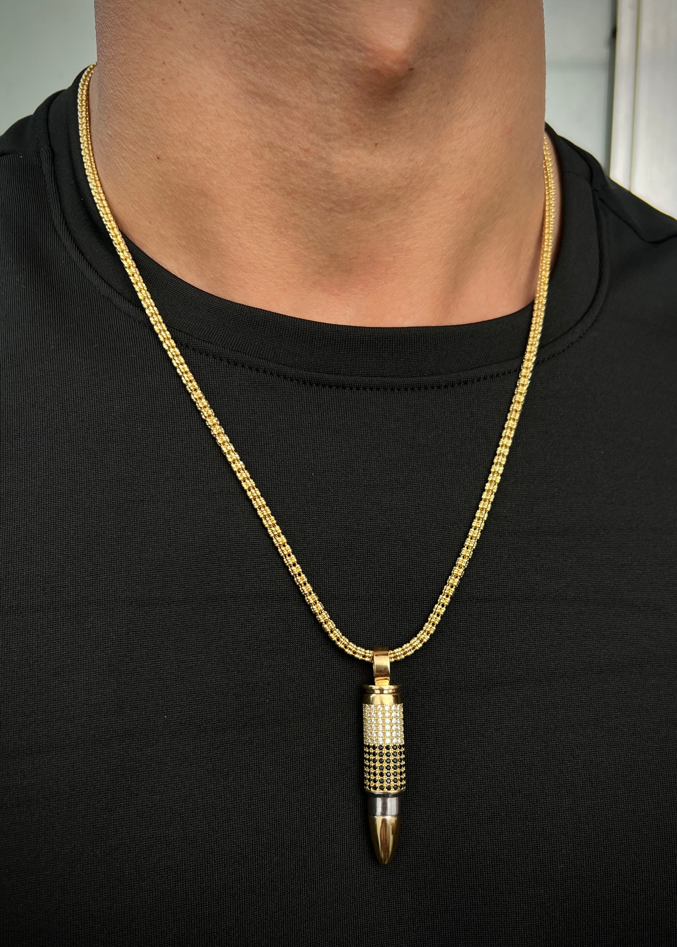 Dije bala 17.35gr / Largo 5.3cm / Dos Oros Nac P