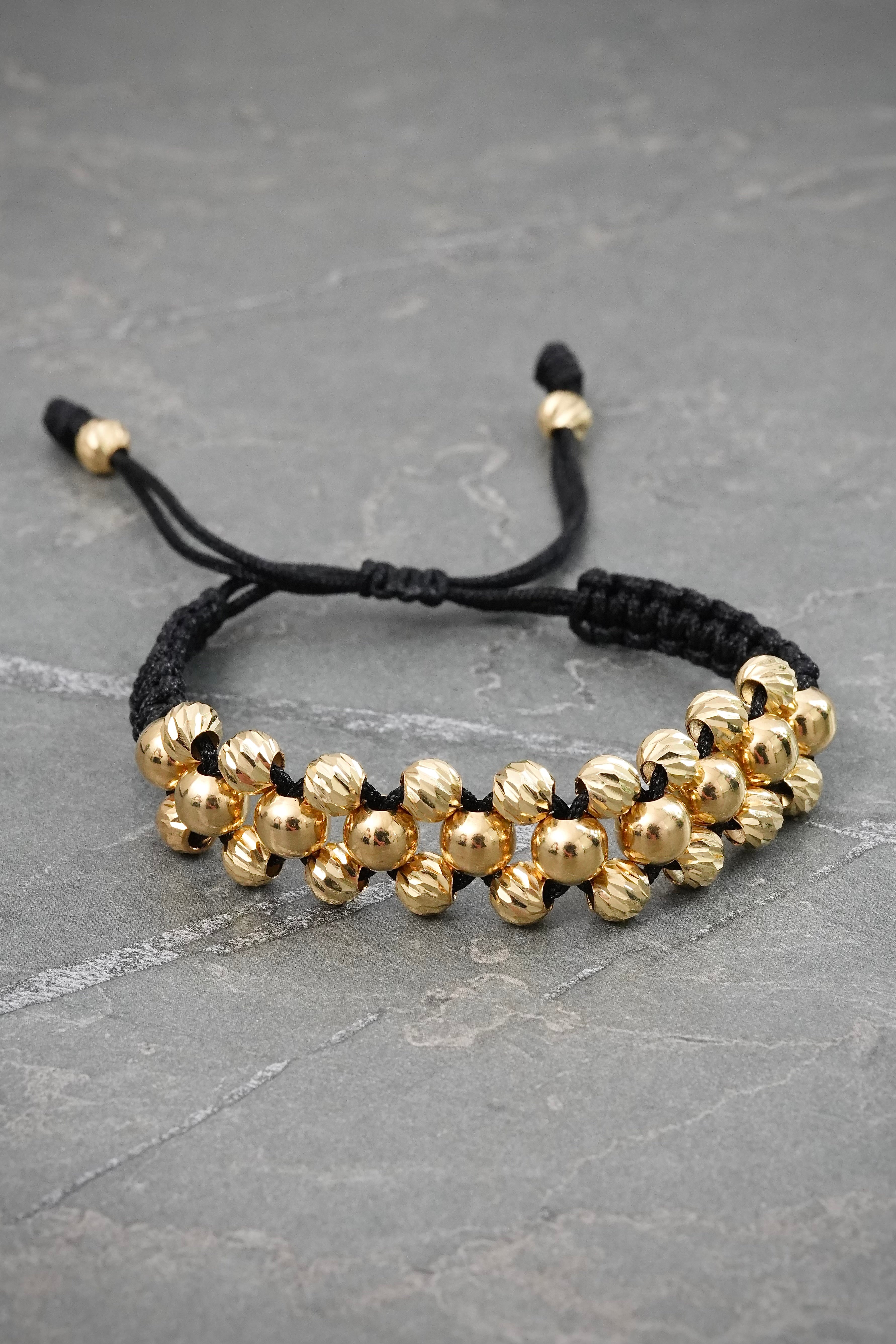 Pulsera en Hilo Negro con Bolas Lisas y Diamantadas 4.6gr — Oro Amarillo
