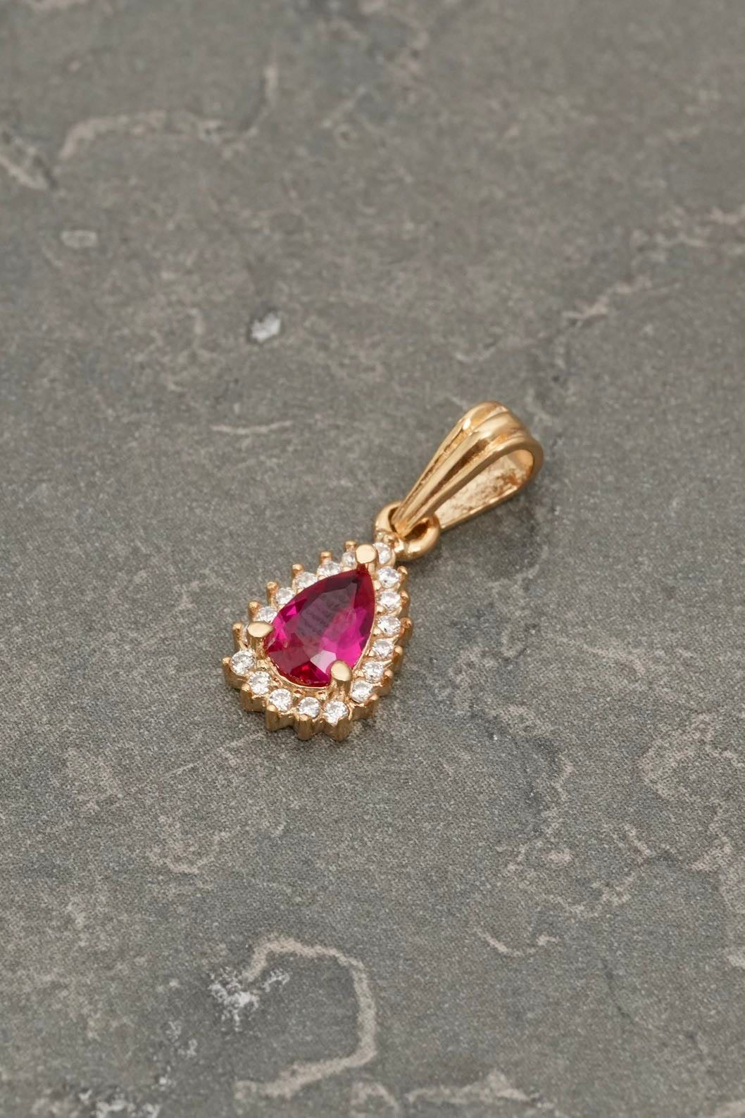 Dije gota con swarovski fucsia y blanco 1.05gr / Largo 1.7cm / Oro Amarillo Nac P