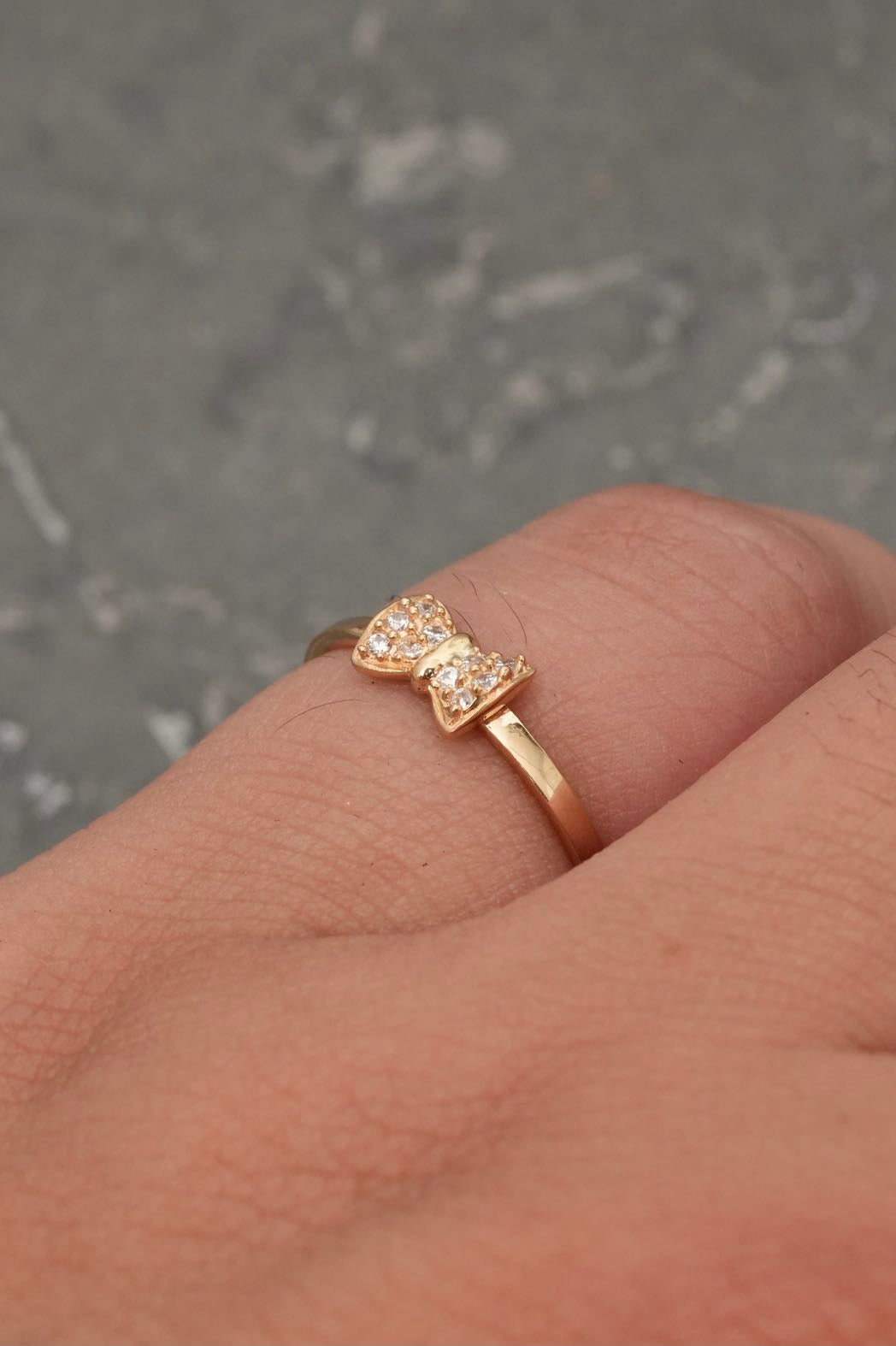 Anillo moño con swarovski blanco 1.25gr / TALLA 6 / Oro Amarillo Nac B