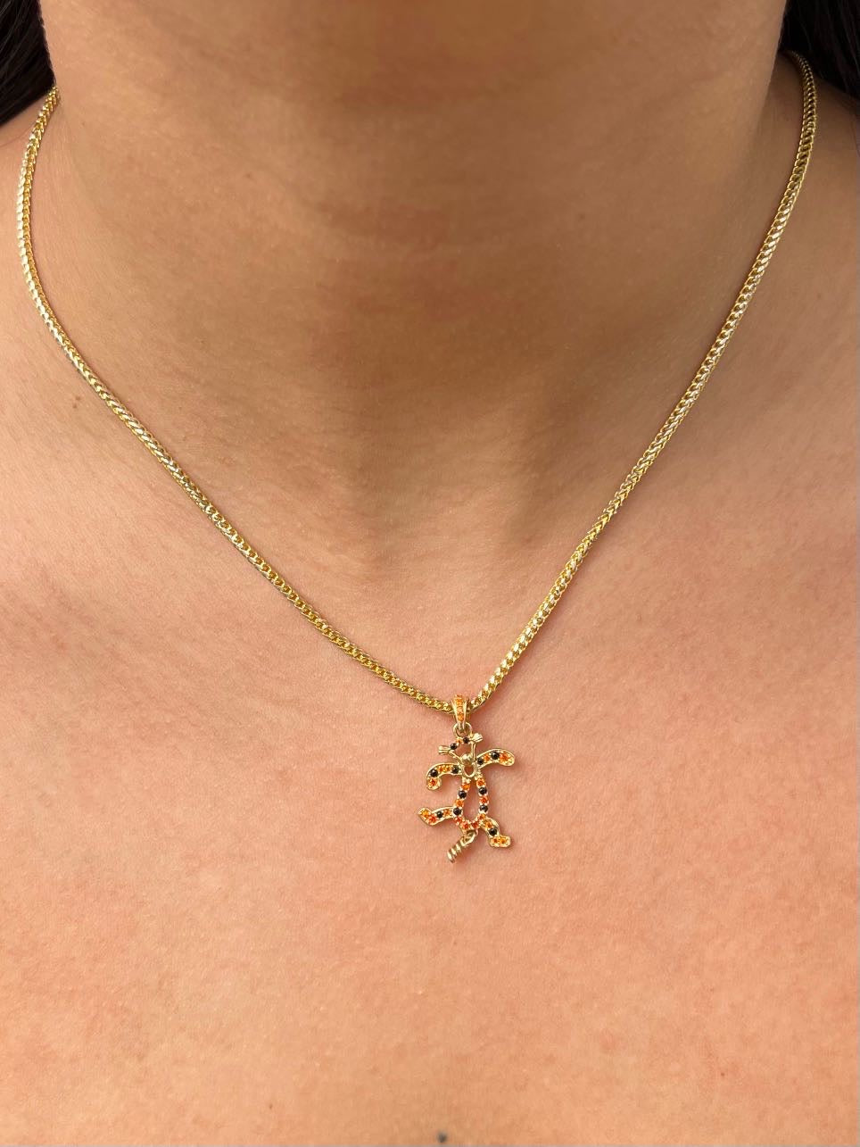 Dije tigger articulado 1.9gr / Largo 2.7cm — Oro Amarillo