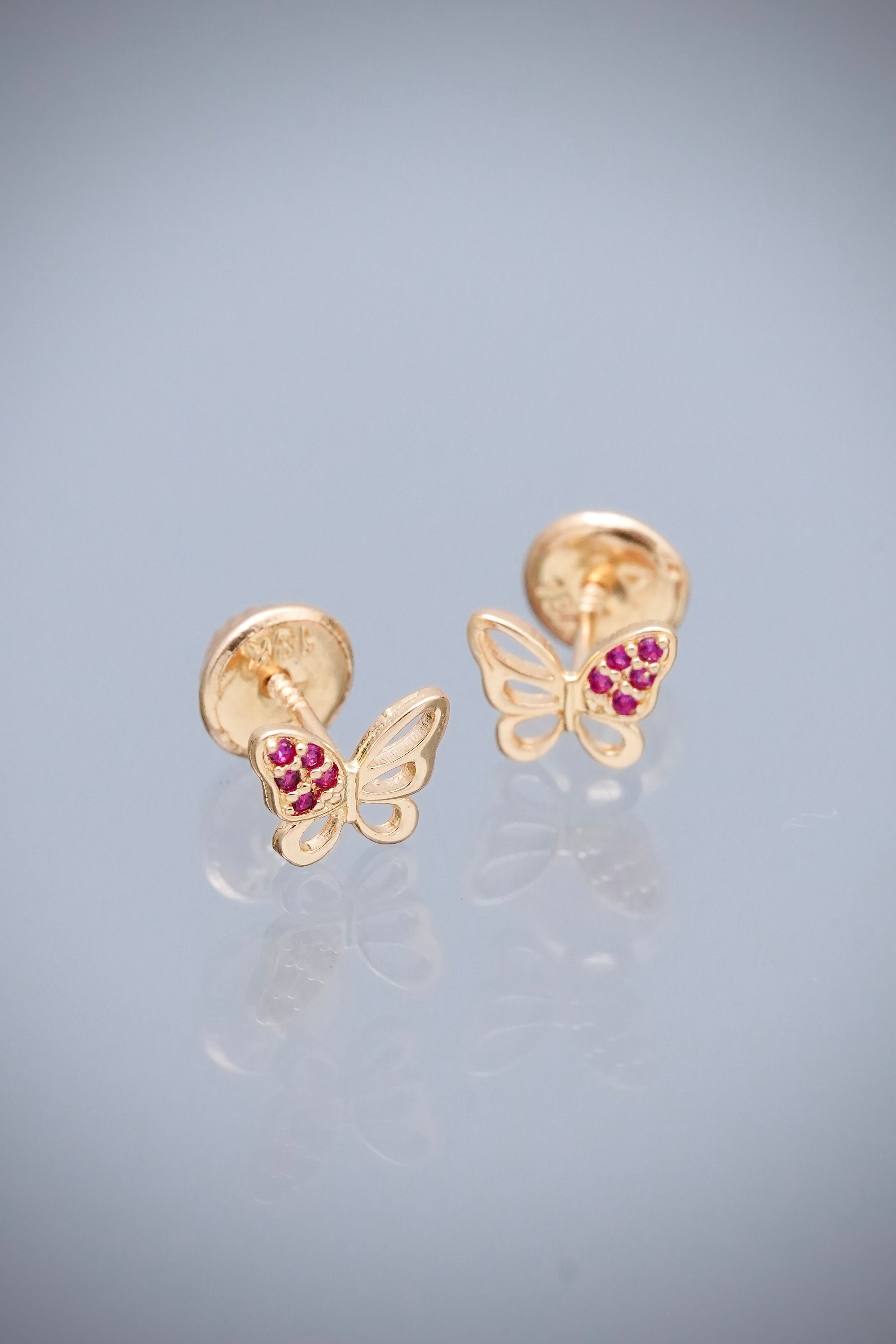 Topos Mariposa con Swarovski fucsia 0.7gr / Largo 0.5cm — Oro Amarillo