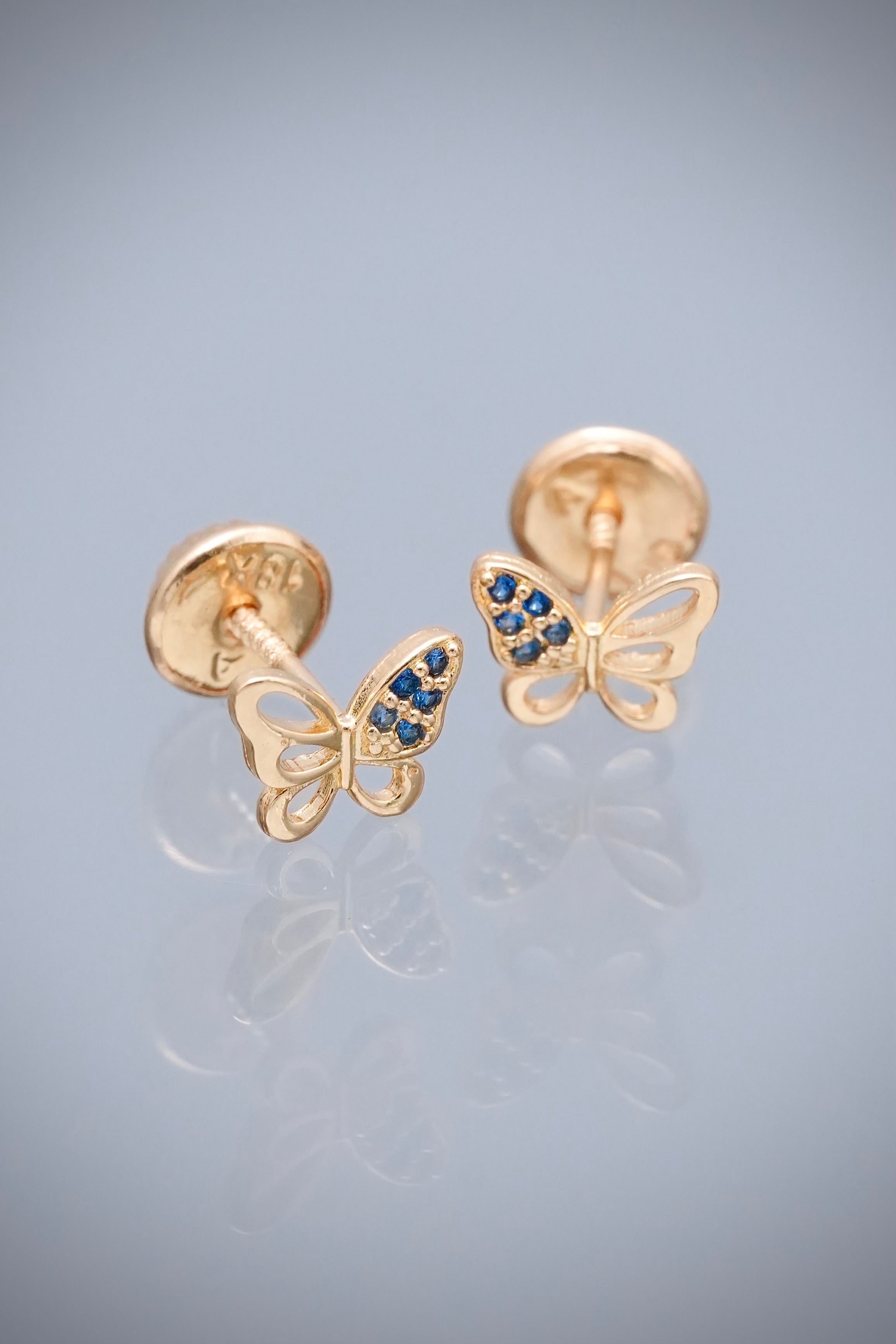 Topos mariposa con swarovski azul 0.7gr / Largo 0.5cm — Oro Amarillo