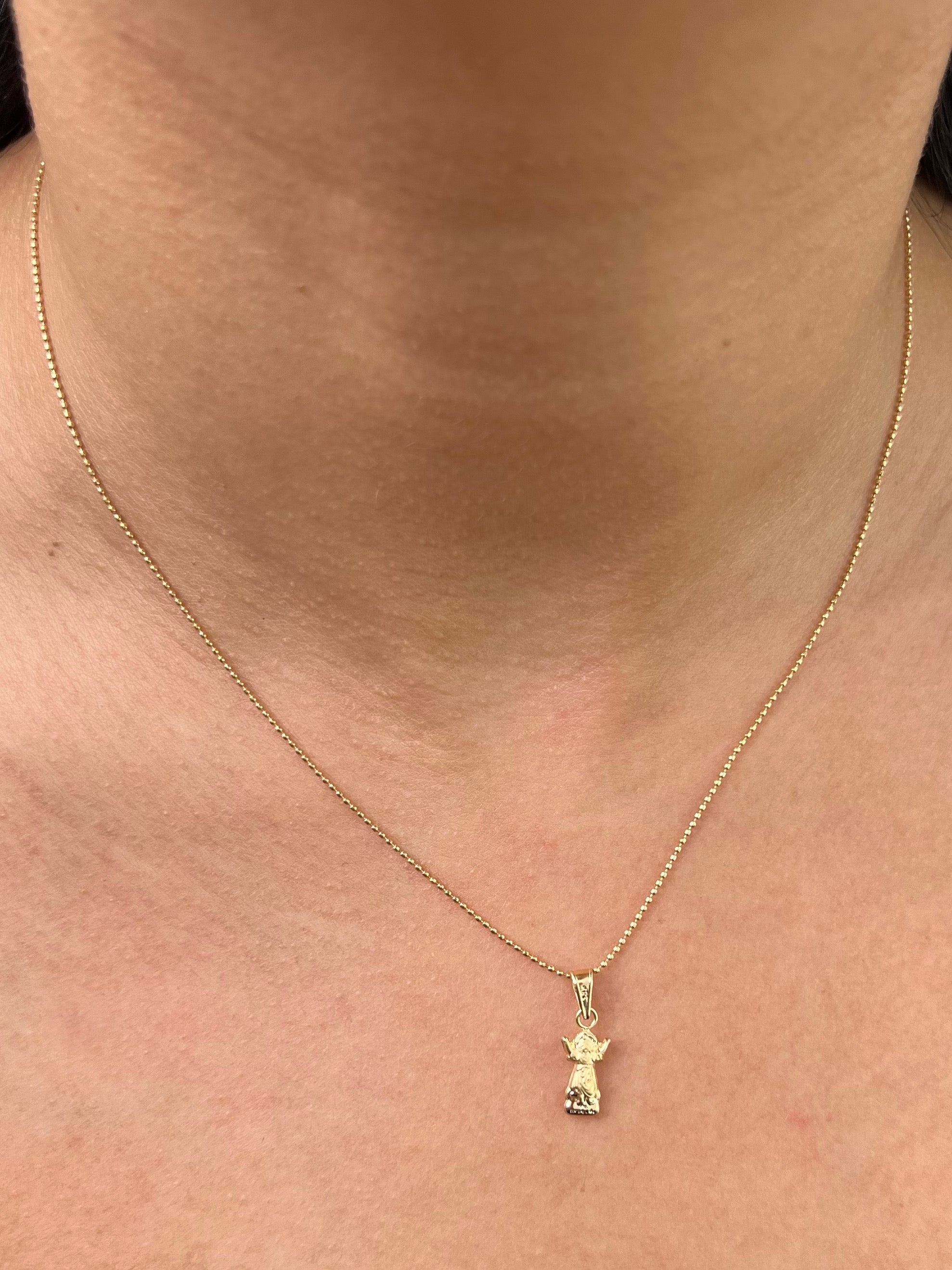 Dije divino niño 0.35gr / Largo 1.8cm / Oro Amarillo Nac P