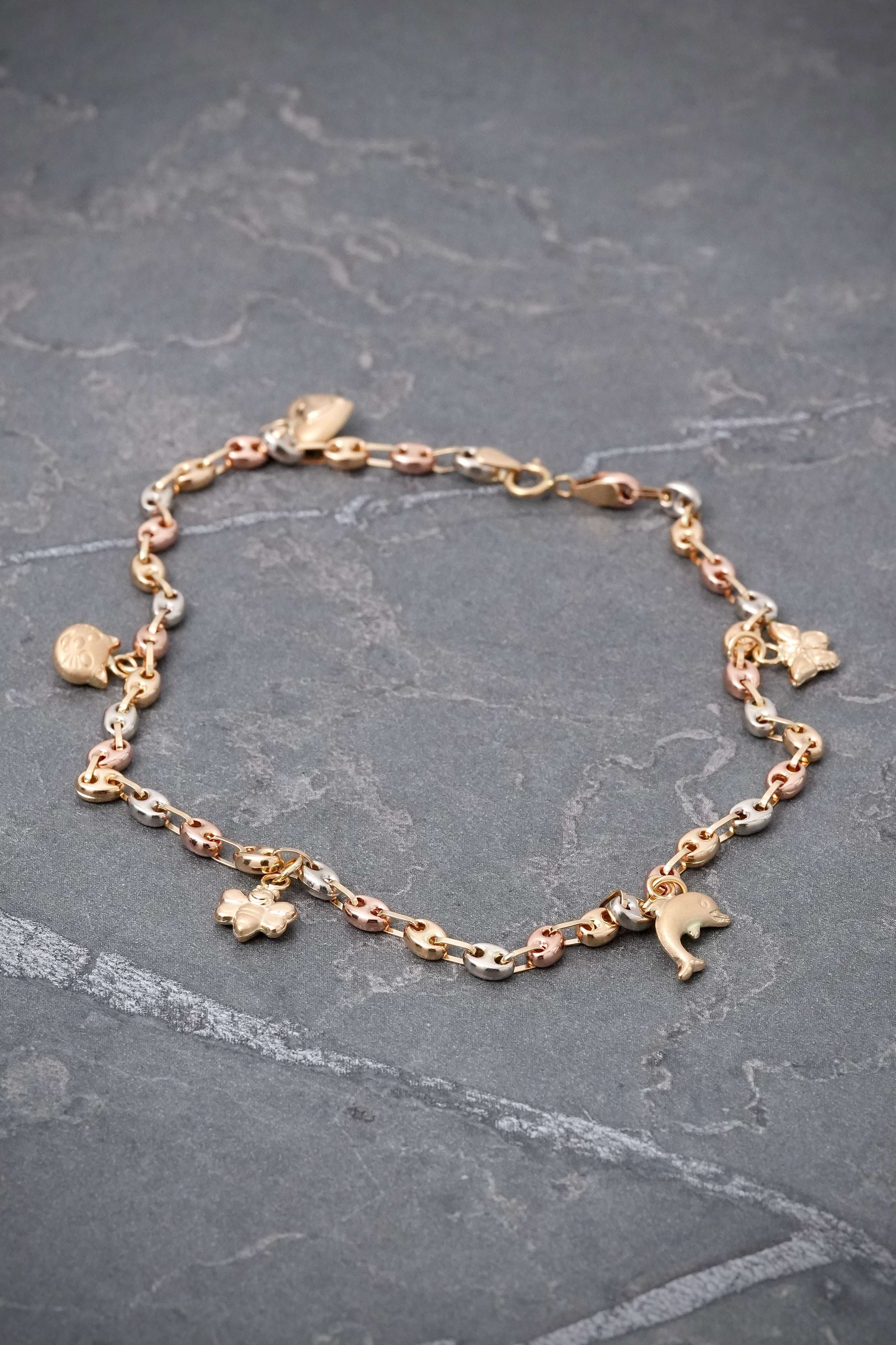 Tobillera gc con dijes 3.7gr / Largo 24cm / Tres Oros Nac B