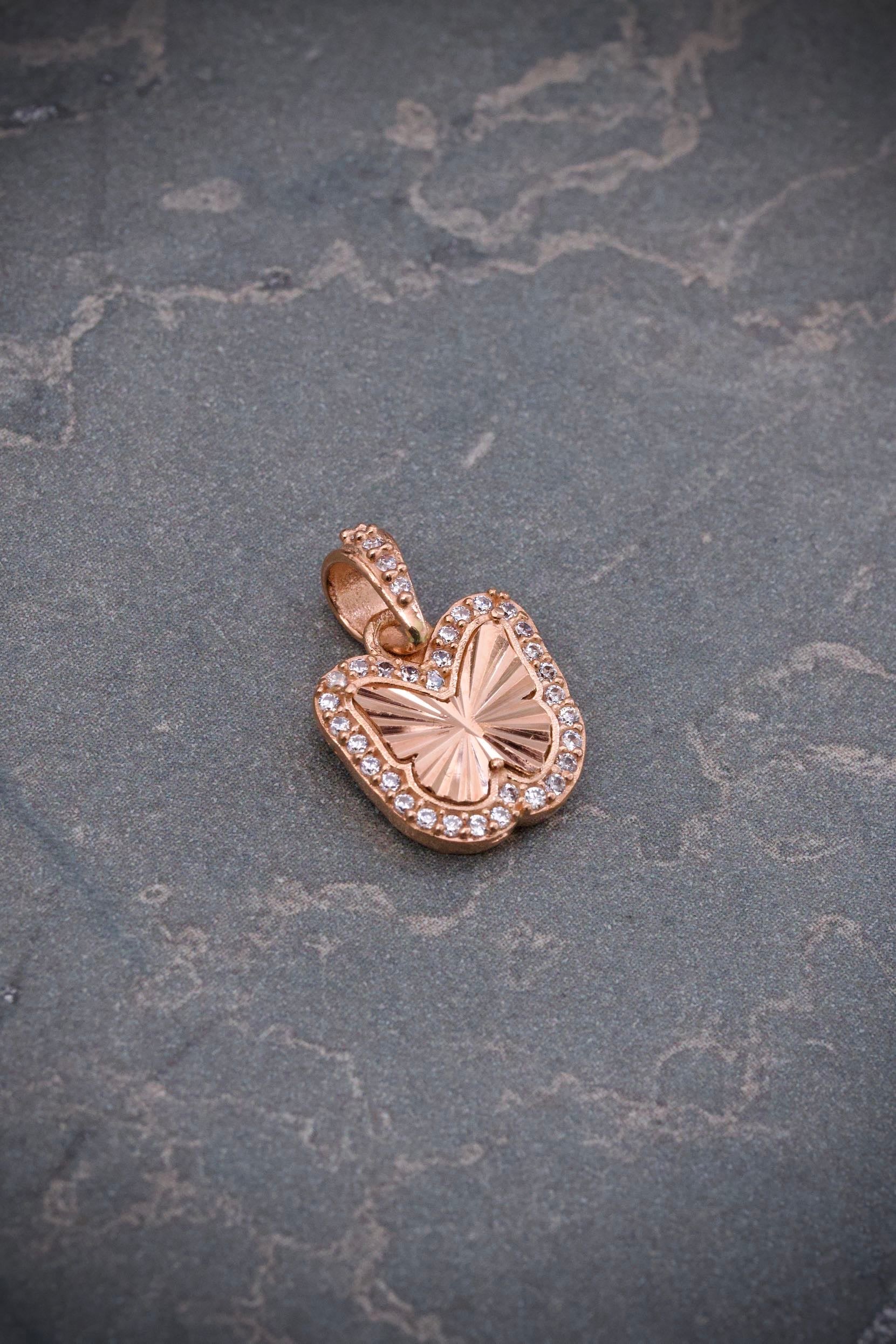 Dije mariposa con swarovski blanco 1.6gr / Largo 1.7cm / Oro Rosado Nac B