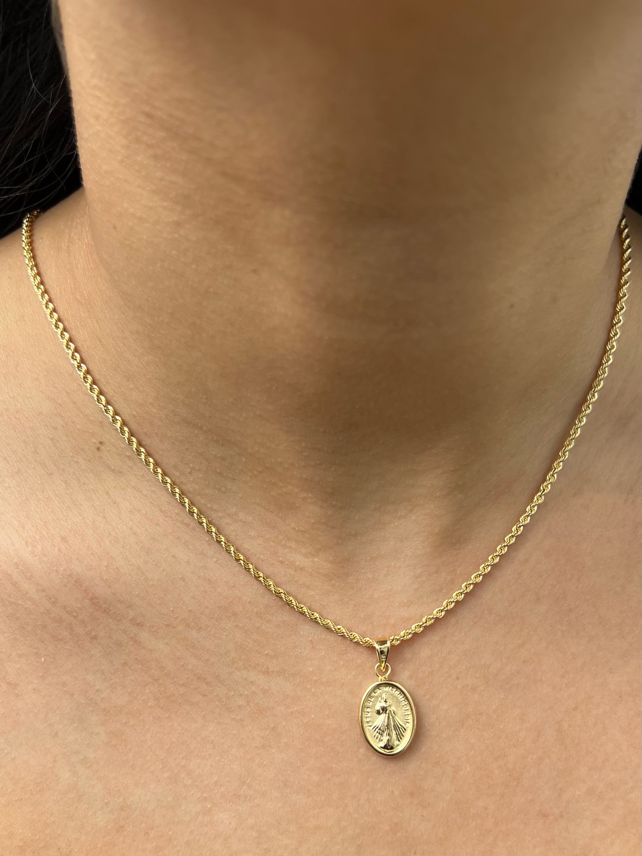 Dije jesus de la misericordia 0.95gr / Largo 2.5cm / Oro Amarillo Nac P