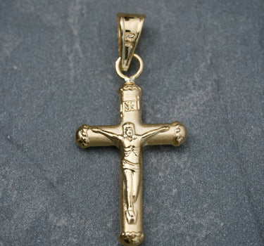 Dije cruz con cristo 0.7gr / Largo 2.9cm / Oro Amarillo Nac B