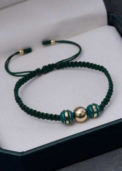 Pulsera en hilo verde con bolas lisas 0.35gr / Oro Amarillo (Joya) *