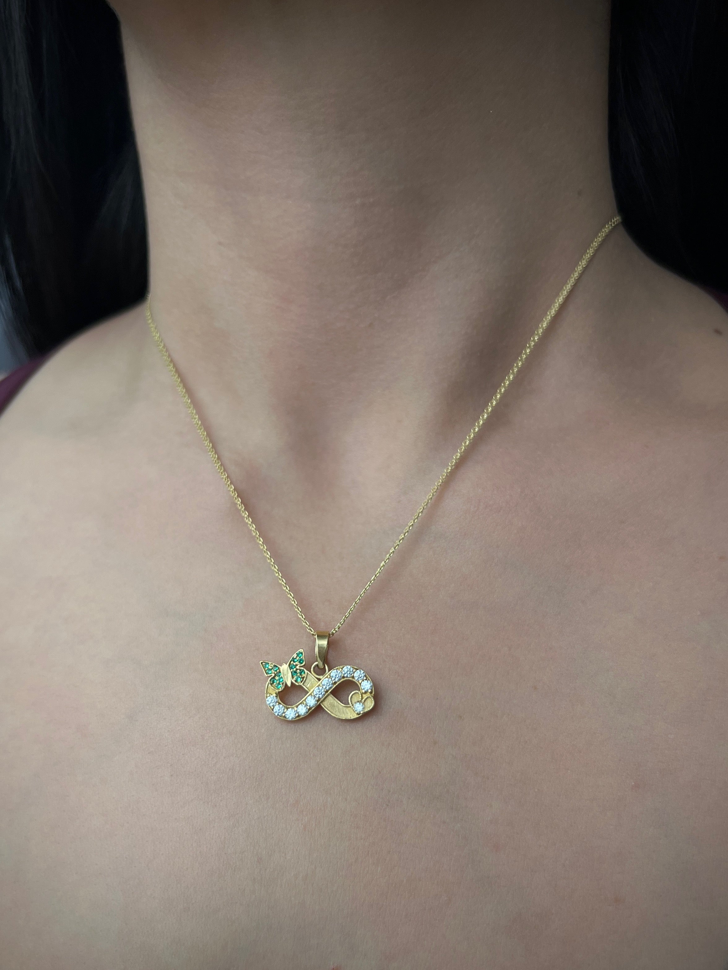 Dije de infinito con moissanitas blancas 0.38qts (38pts) 3.1gr / Oro Amarillo (Joya) P