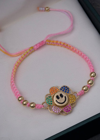 Pulsera en hilo rosado con herraje de flor 4.7gr / Oro Amarillo (Joya) M
