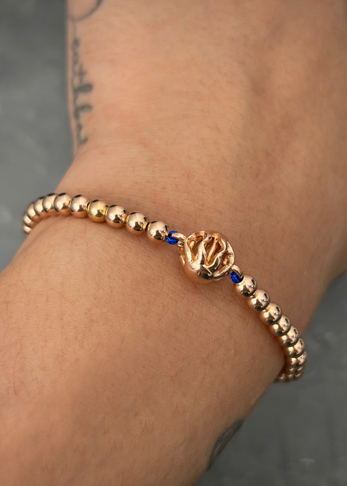 Pulsera en hilo azul con herraje de sol 5.45gr / Oro Rosado (Joya) M