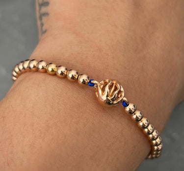 Pulsera en hilo azul con herraje de sol 5.45gr / Oro Rosado (Joya) M