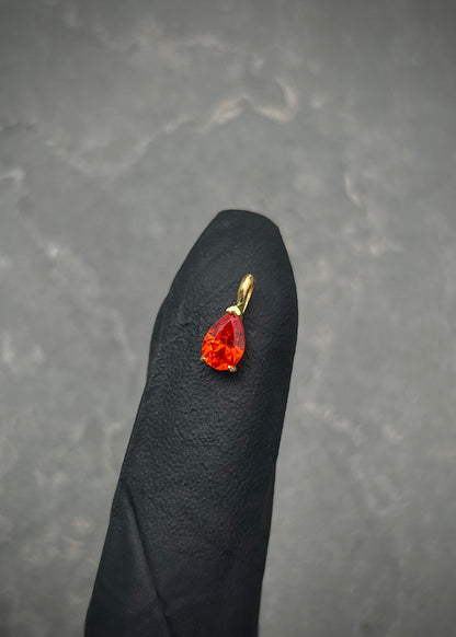 Dije con swarovski naranjado 0.45gr / Largo 0.9cm / Oro Amarillo Nac P